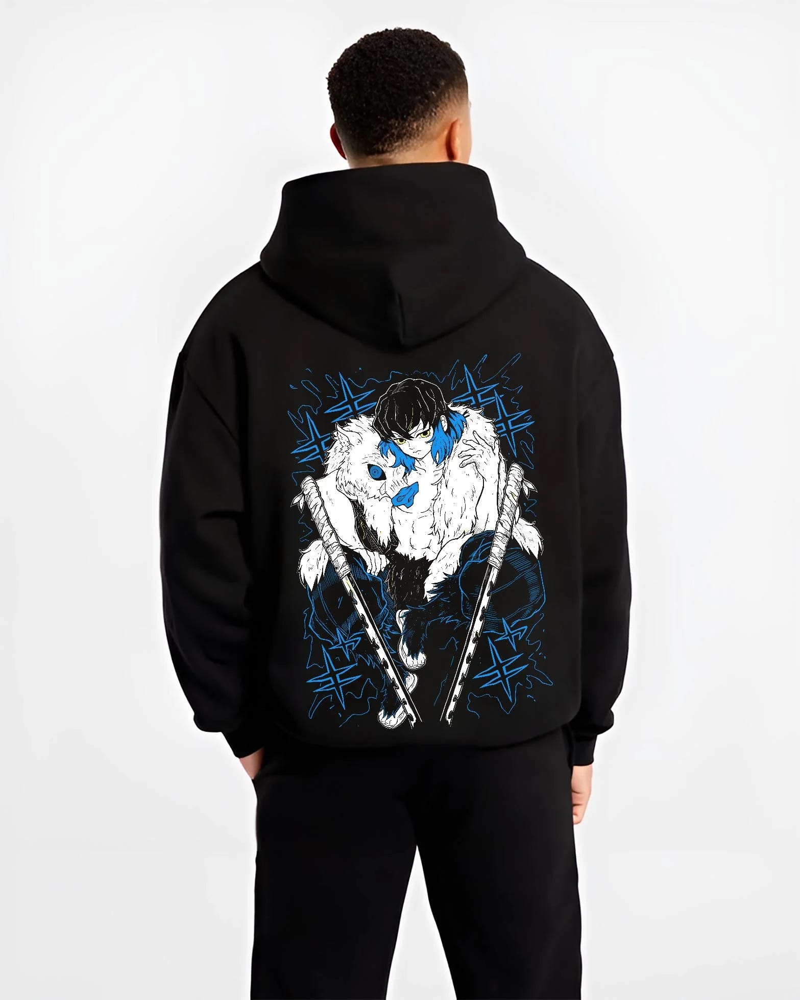 Black hoodie worn by male model, back view with Demon Slayer Hoodie Inosuke Hashibira Dynamic Jumper graphic streetwear graphic.
