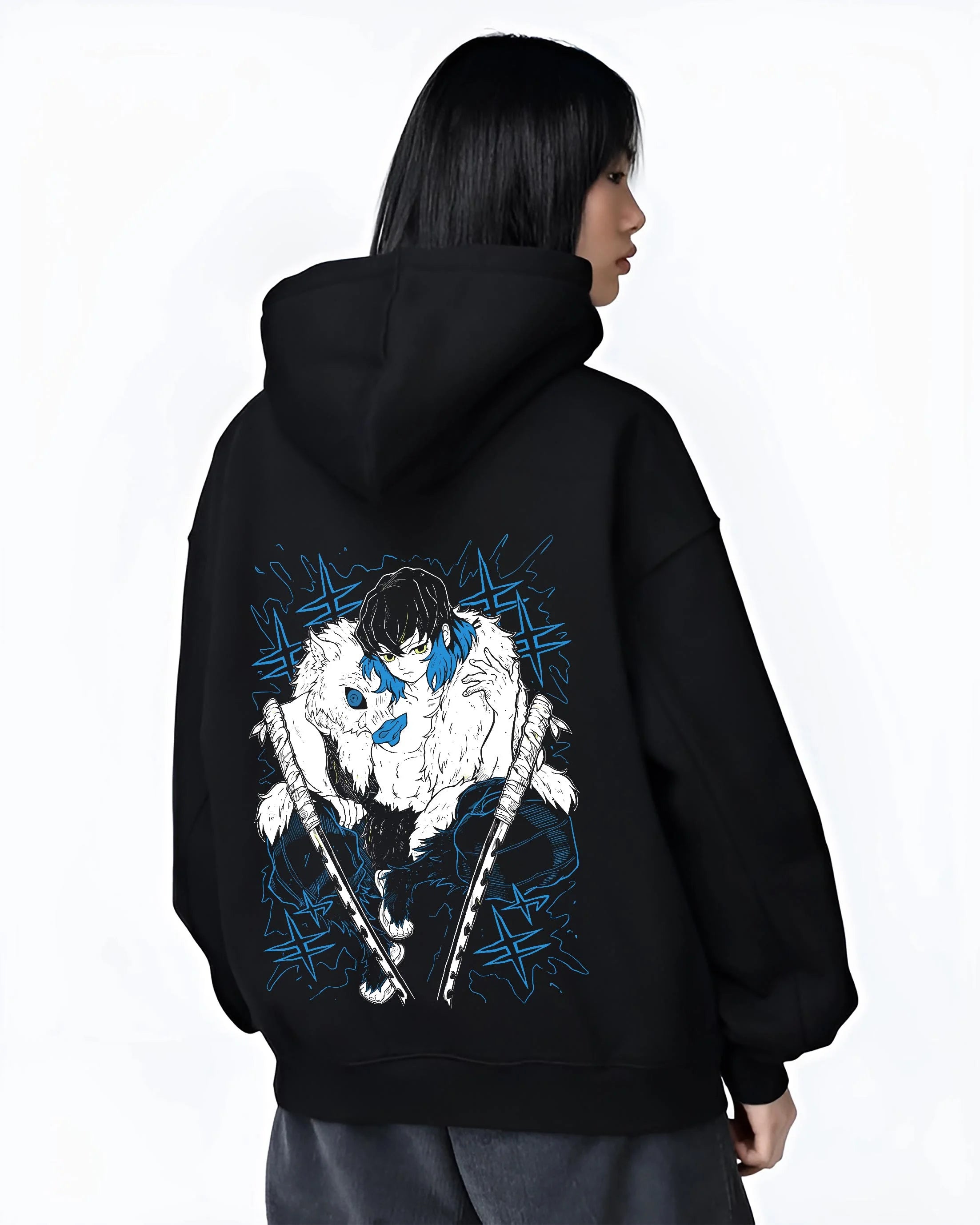 Black hoodie worn by female model, back view with Demon Slayer Hoodie Inosuke Hashibira Dynamic Jumper graphic bold anime graphic.