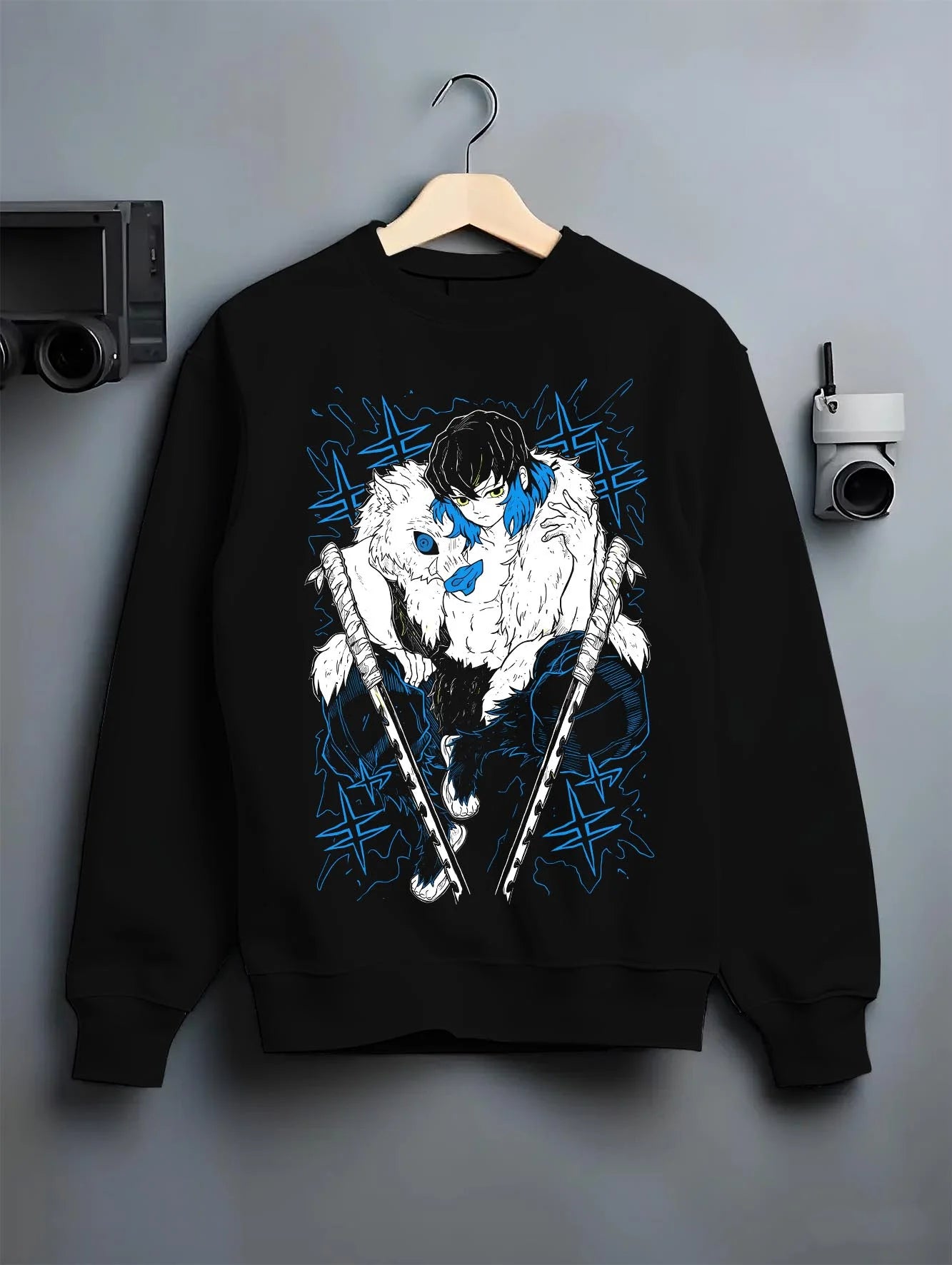 Black crewneck sweatshirt on hanger with Demon Slayer Hoodie Inosuke Hashibira Dynamic Jumper graphic streetwear graphic.