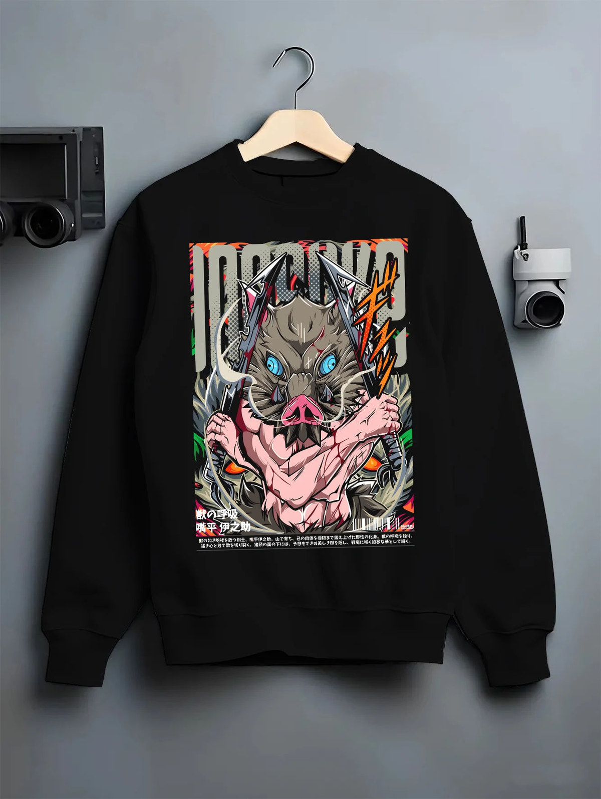 Black crewneck sweatshirt on hanger showing Inosuke Hashibira from Demon Slayer: blue-eyed boar mask
