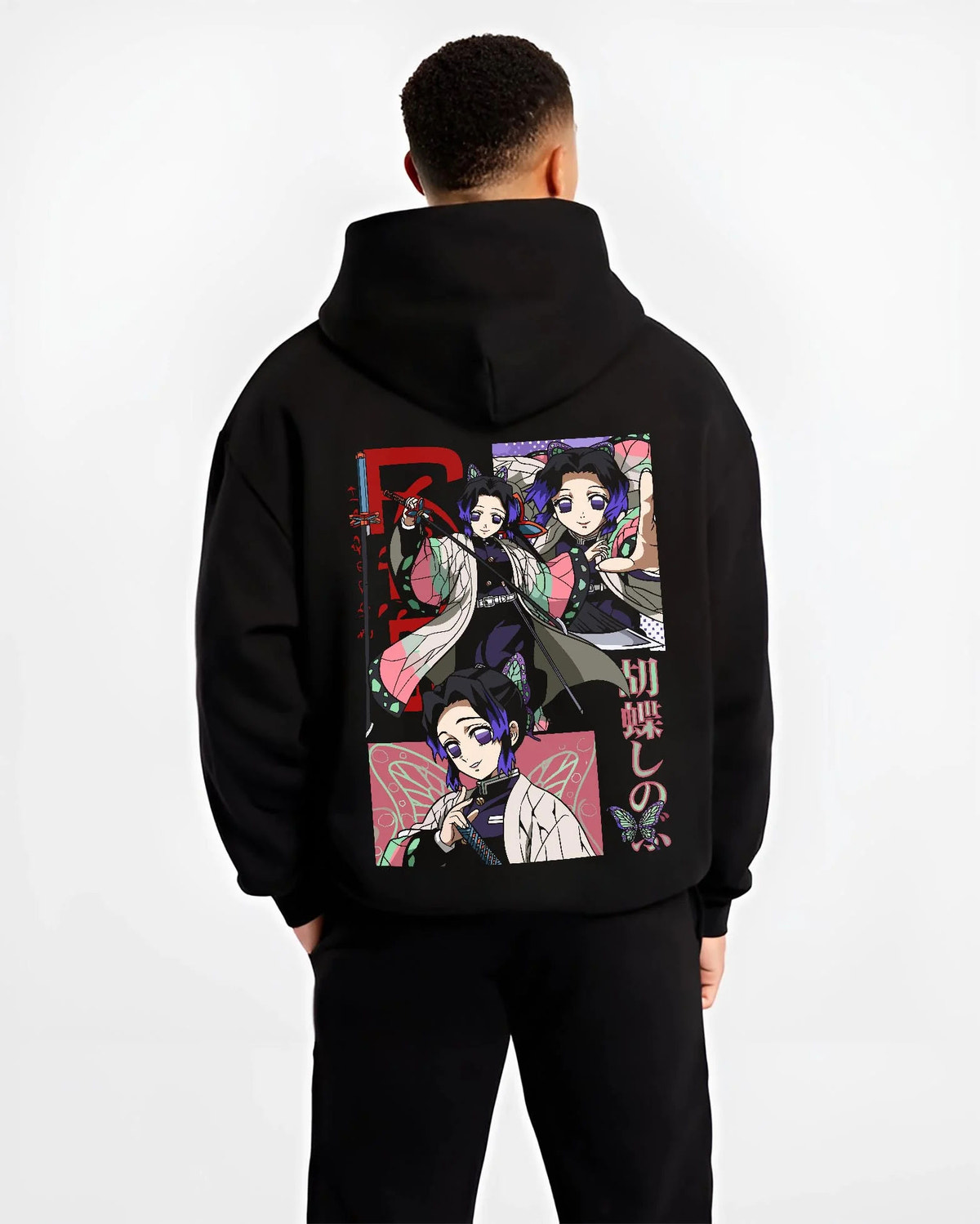 Black hoodie worn by male model from the back featuring Shinobu Kocho Insect Hashira butterfly artwork.