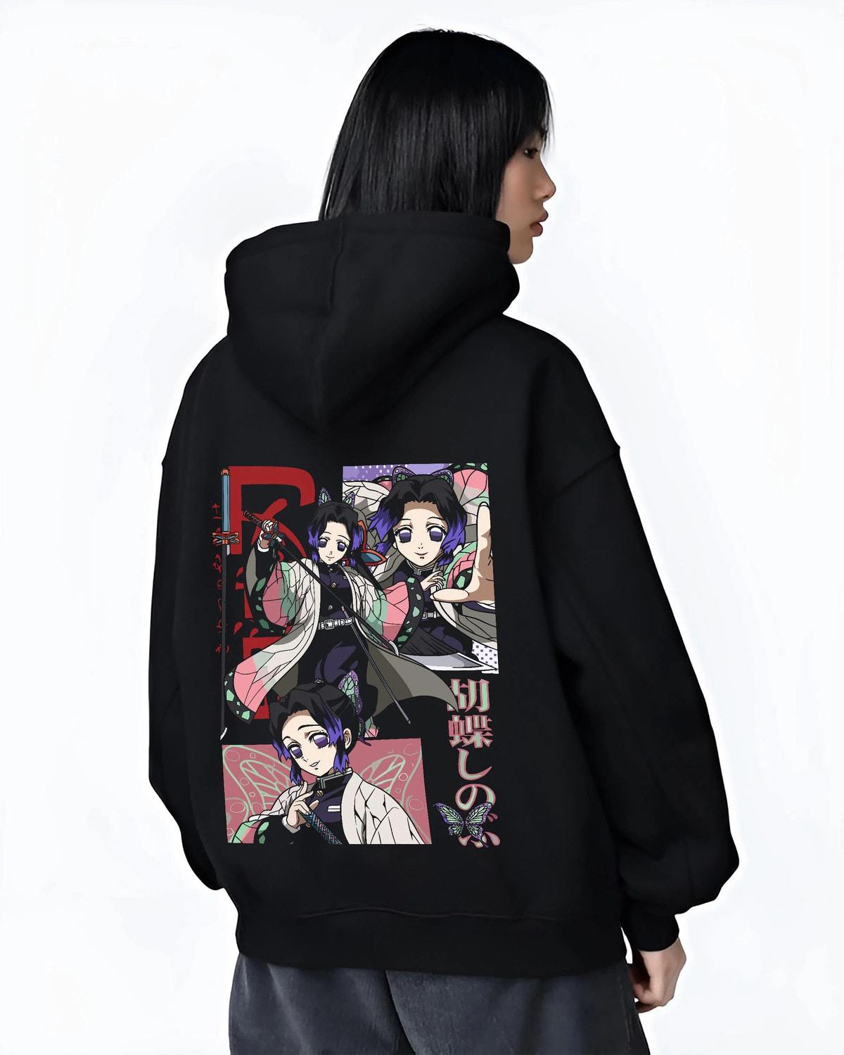 Black hoodie worn by female model from the back featuring Shinobu Kocho Insect Hashira butterfly artwork.
