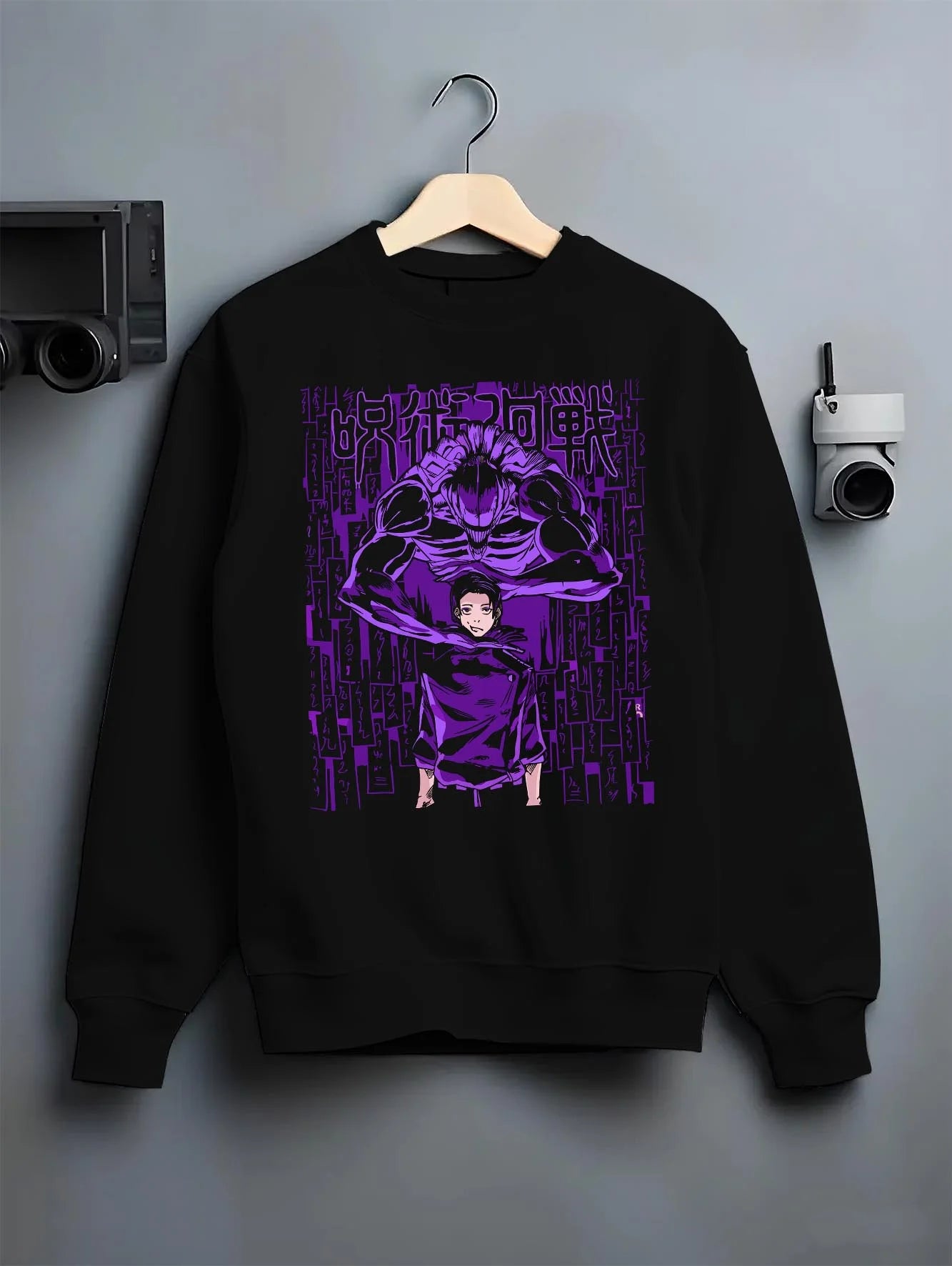 Black crewneck sweatshirt on hanger with Jujutsu Kaisen Hoodie Toge Inumaki Cursed Speech Jumper graphic bold anime graphic.