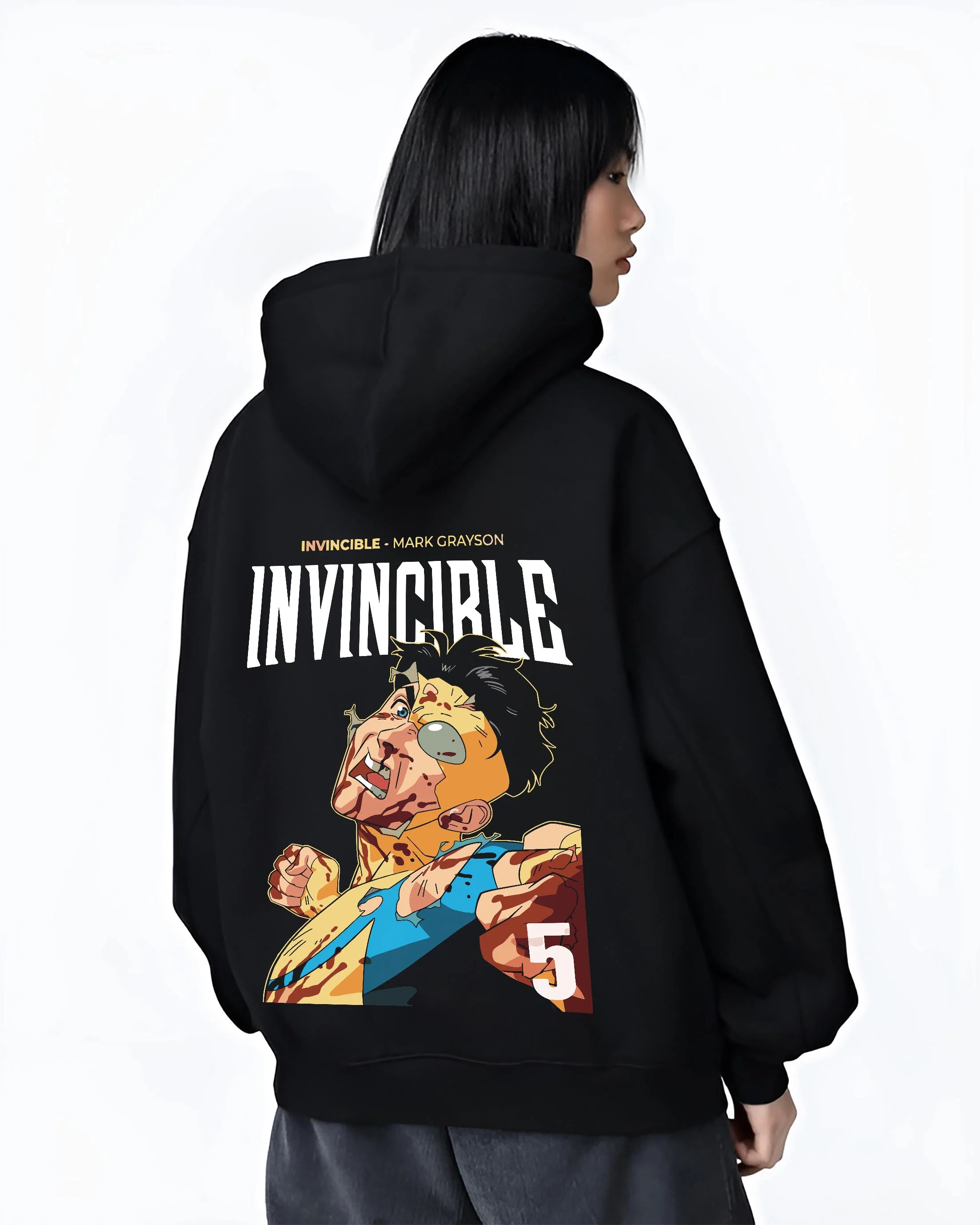 Black hoodie worn by female model, back view with Invincible Hoodie Mark Grayson Battle Damage Jumper graphic premium wear.