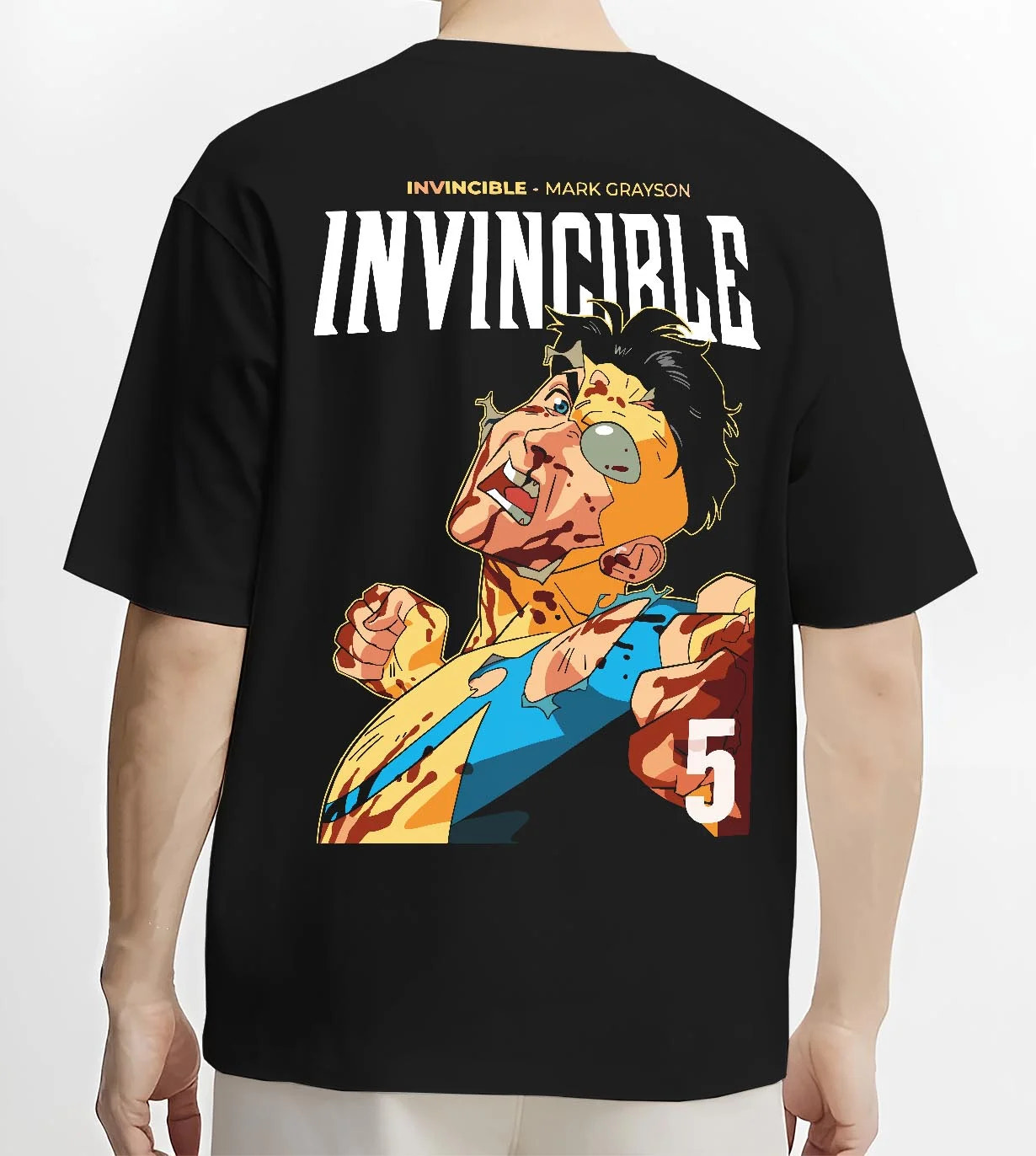 Black T-shirt worn by male model, back view with Invincible Hoodie Mark Grayson Battle Damage Jumper graphic bold anime graphic.