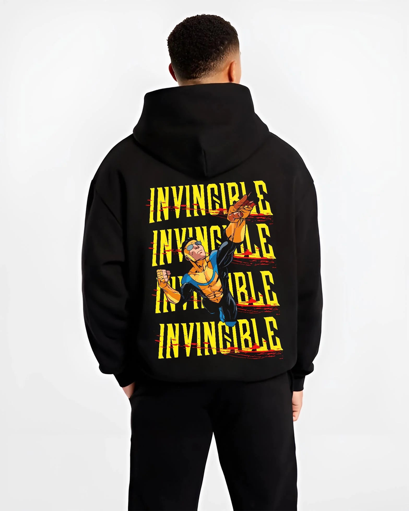 Black hoodie worn by male model, back view with Invincible Hoodie Mark Grayson Ultimate Strength Jumper graphic streetwear graphic.