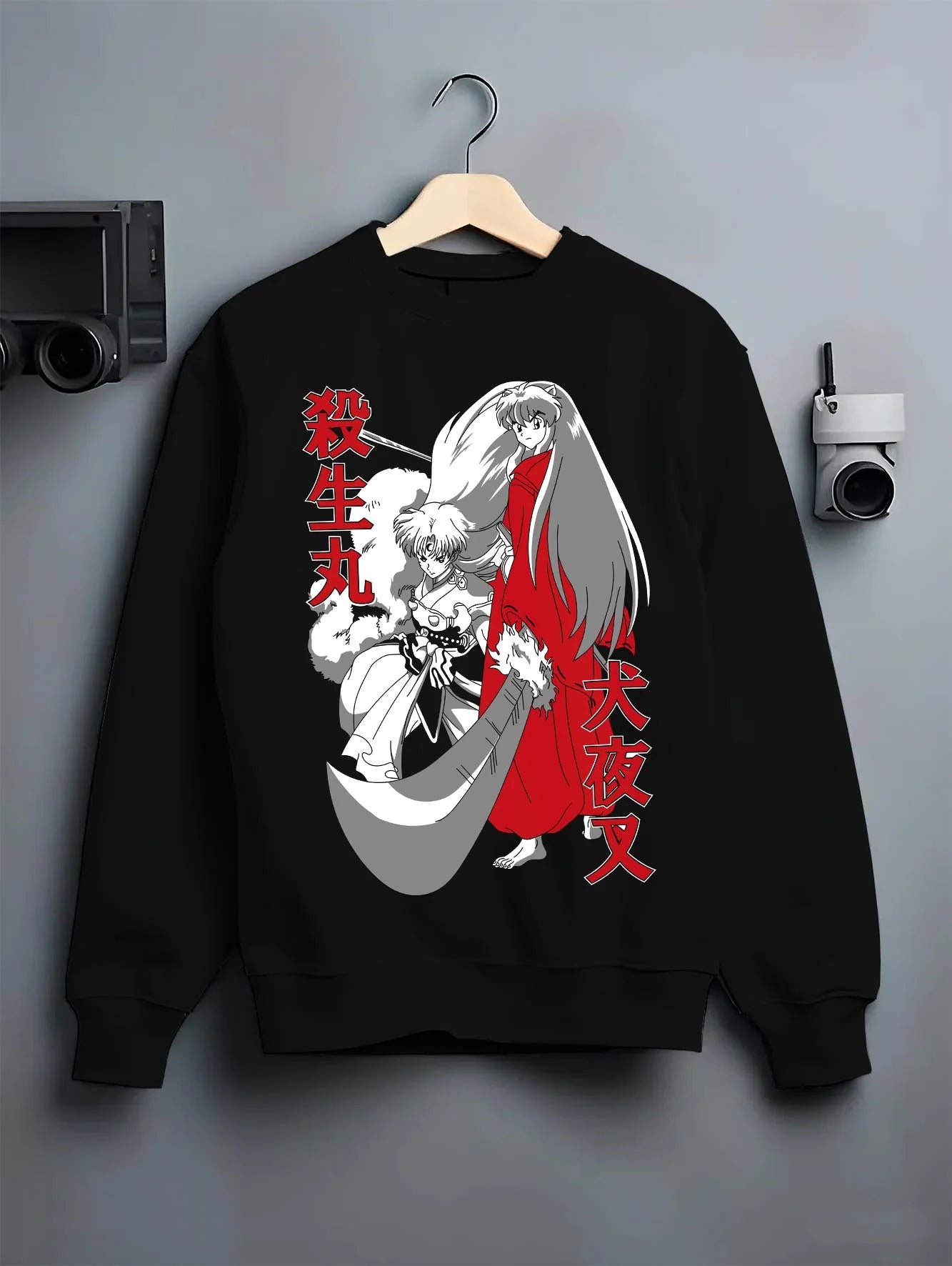 Black crewneck sweatshirt on hanger with Inuyasha Hoodie Sesshomaru and Inuyasha Jumper graphic bold anime graphic.