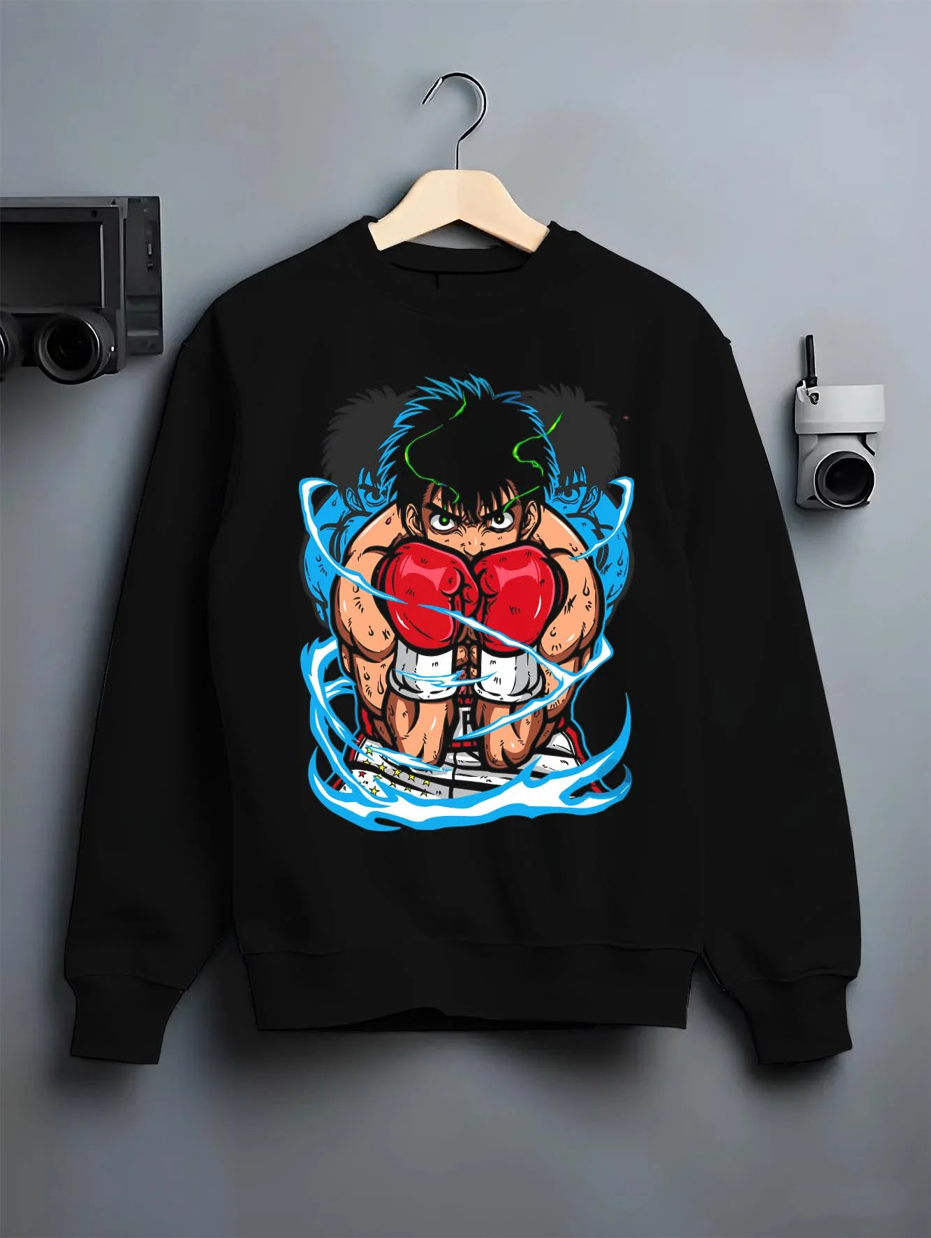 Black crewneck sweatshirt on hanger with Hajime no Ippo Hoodie Ippo Makunouchi Punch Jumper graphic streetwear graphic.