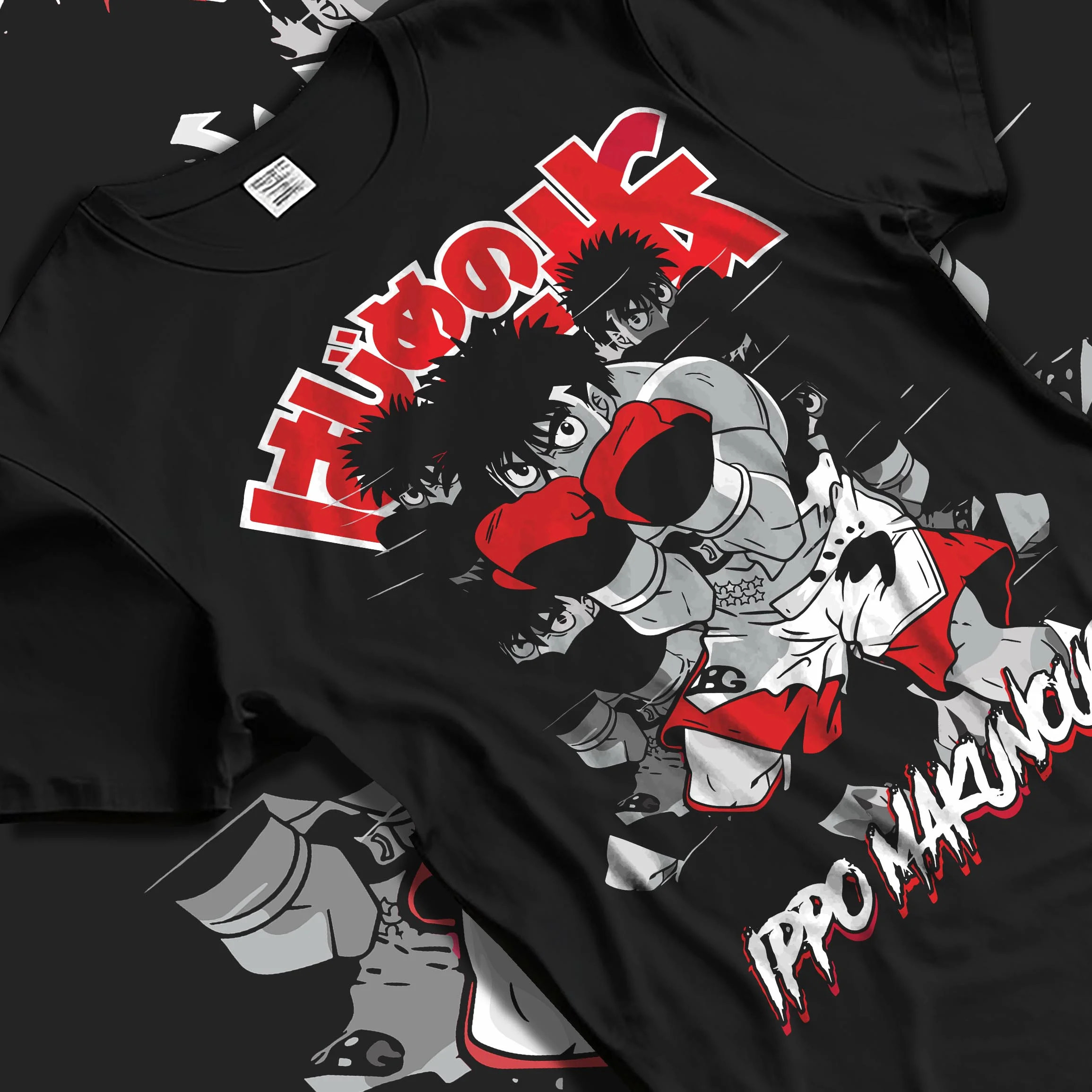 Black T-shirt laid flat with natural folds with Hajime no Ippo Hoodie Ippo Makunouchi Determined Jumper graphic bold anime graphic.