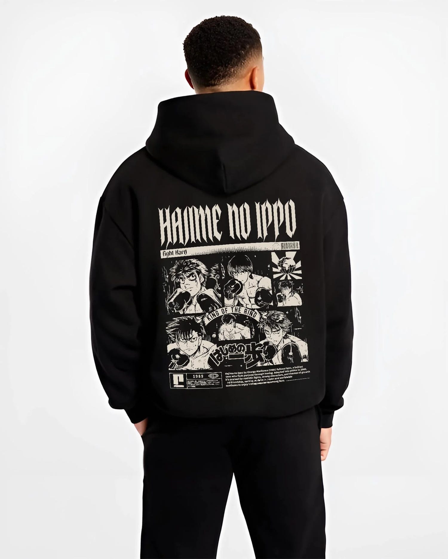 Black hoodie worn by male model, back view with Hajime no Ippo Hoodie Ippo Makunouchi Champion Jumper graphic streetwear graphic.
