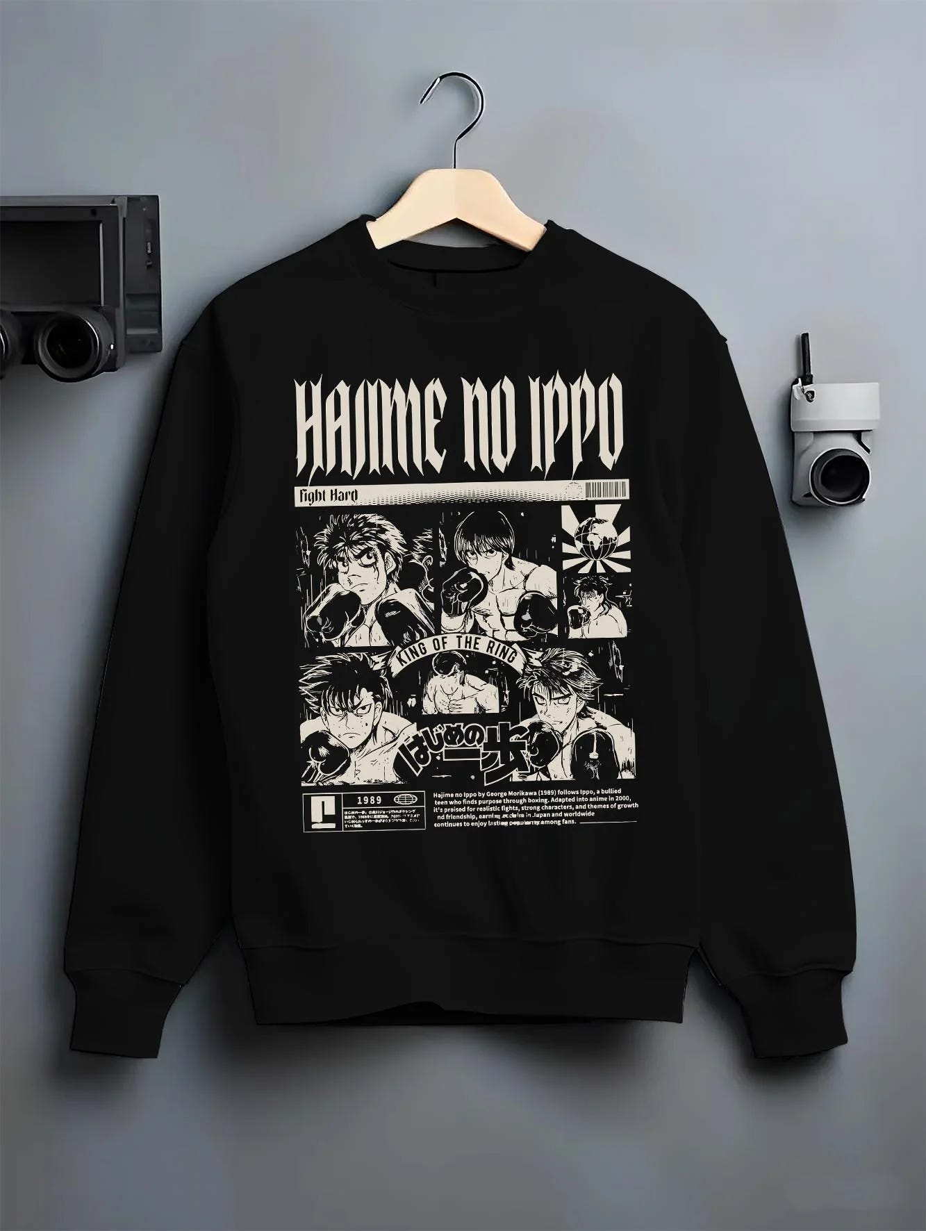 Black crewneck sweatshirt on hanger with Hajime no Ippo Hoodie Ippo Makunouchi Champion Jumper graphic bold anime graphic.