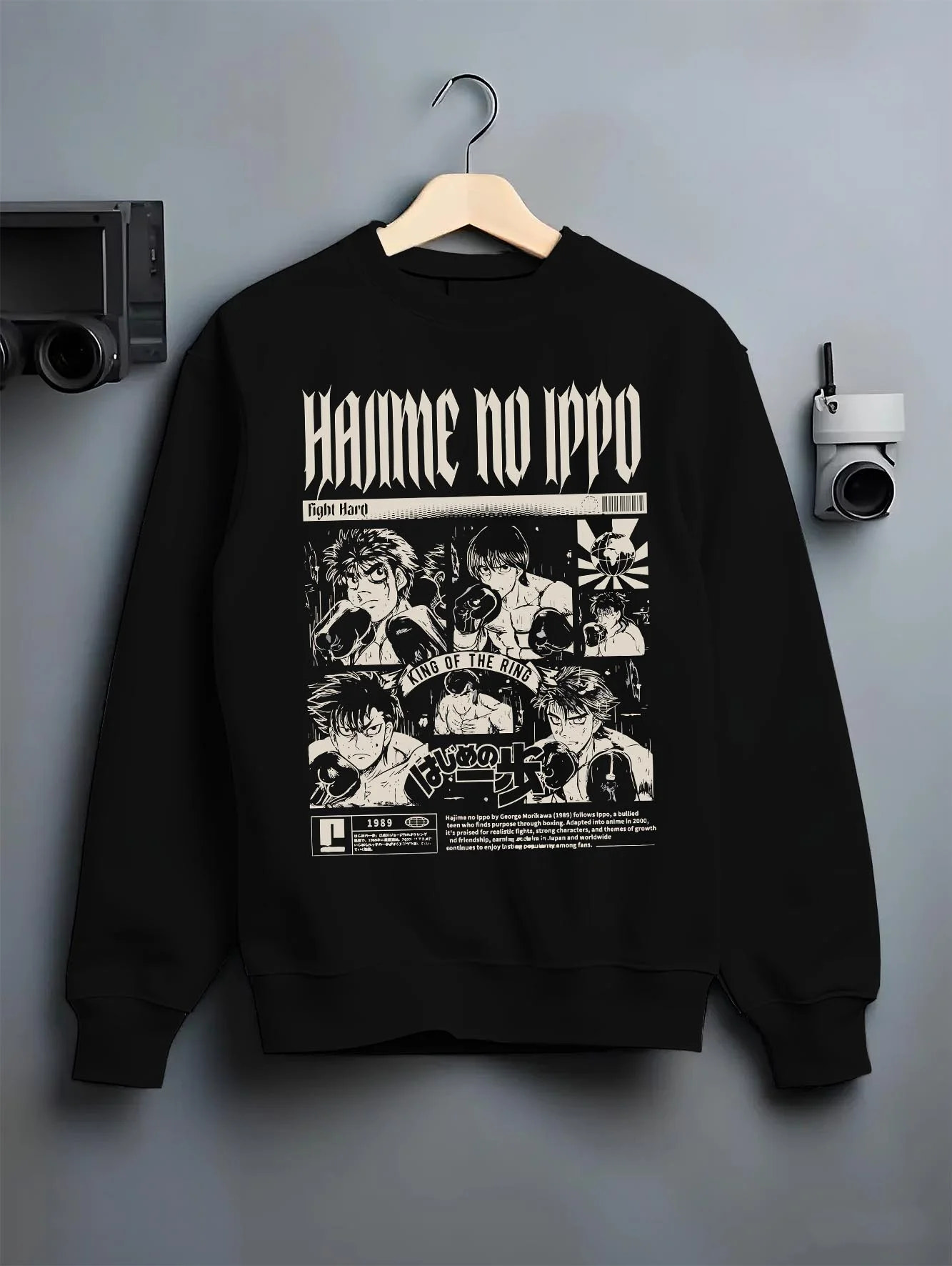 Black crewneck sweatshirt on hanger with Hajime no Ippo Hoodie Ippo Makunouchi Champion Jumper graphic bold anime graphic.