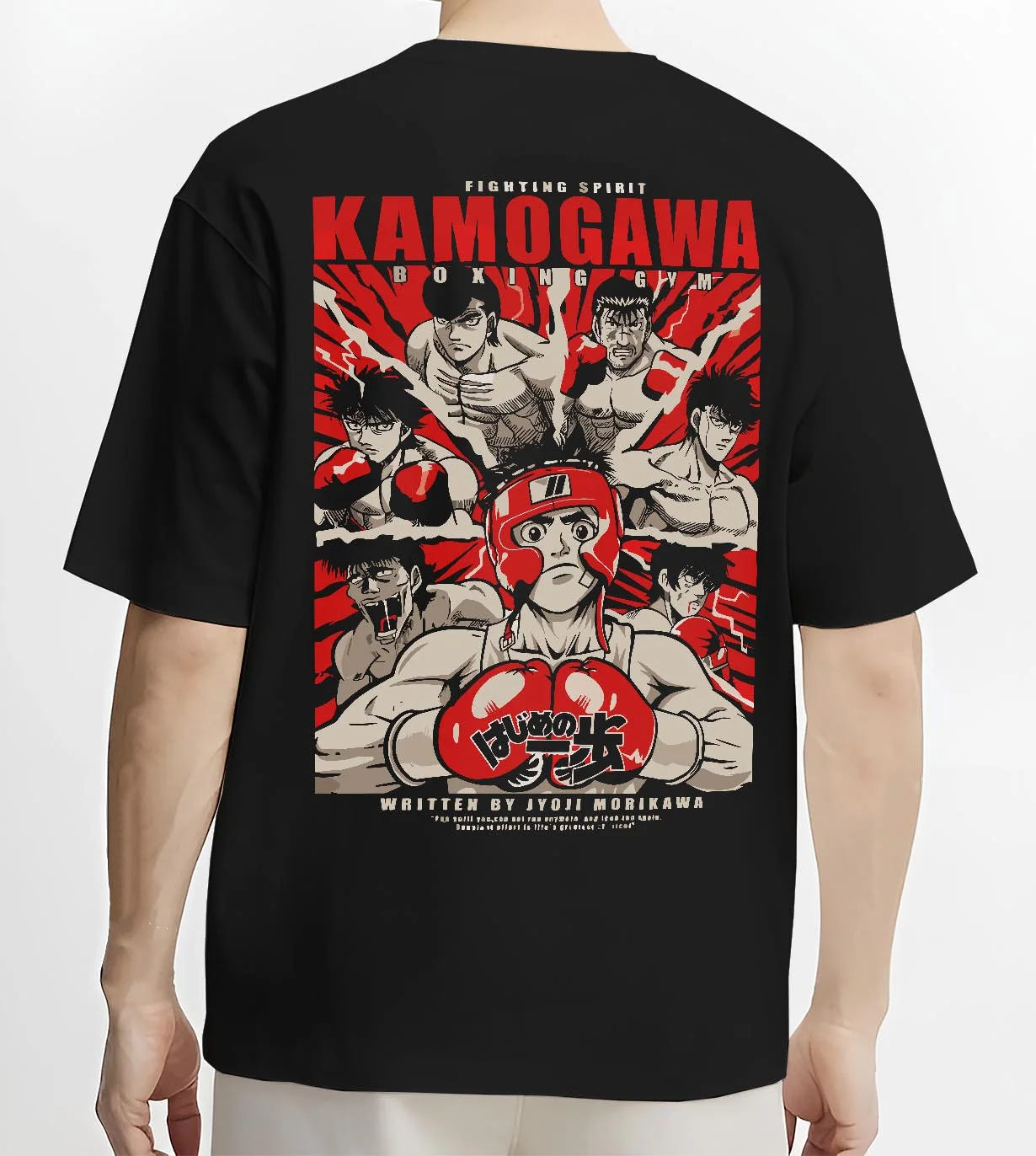 Black T-shirt worn by male model, back view with Hajime no Ippo Hoodie Kamogawa Gym Boxing Jumper graphic bold anime graphic.