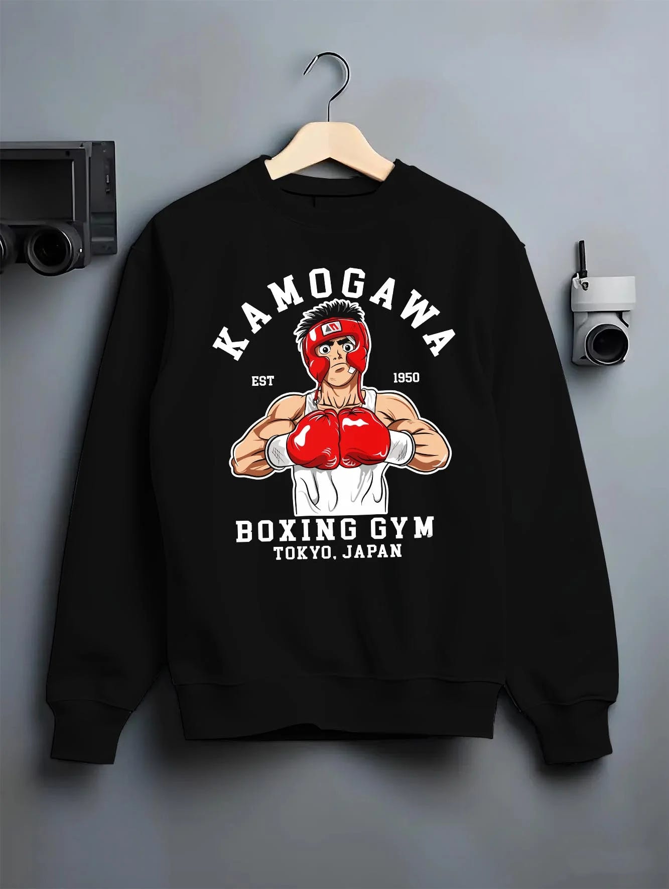 Black crewneck sweatshirt on hanger with Hajime no Ippo Hoodie Ippo Makunouchi Ring Jumper graphic bold anime graphic.