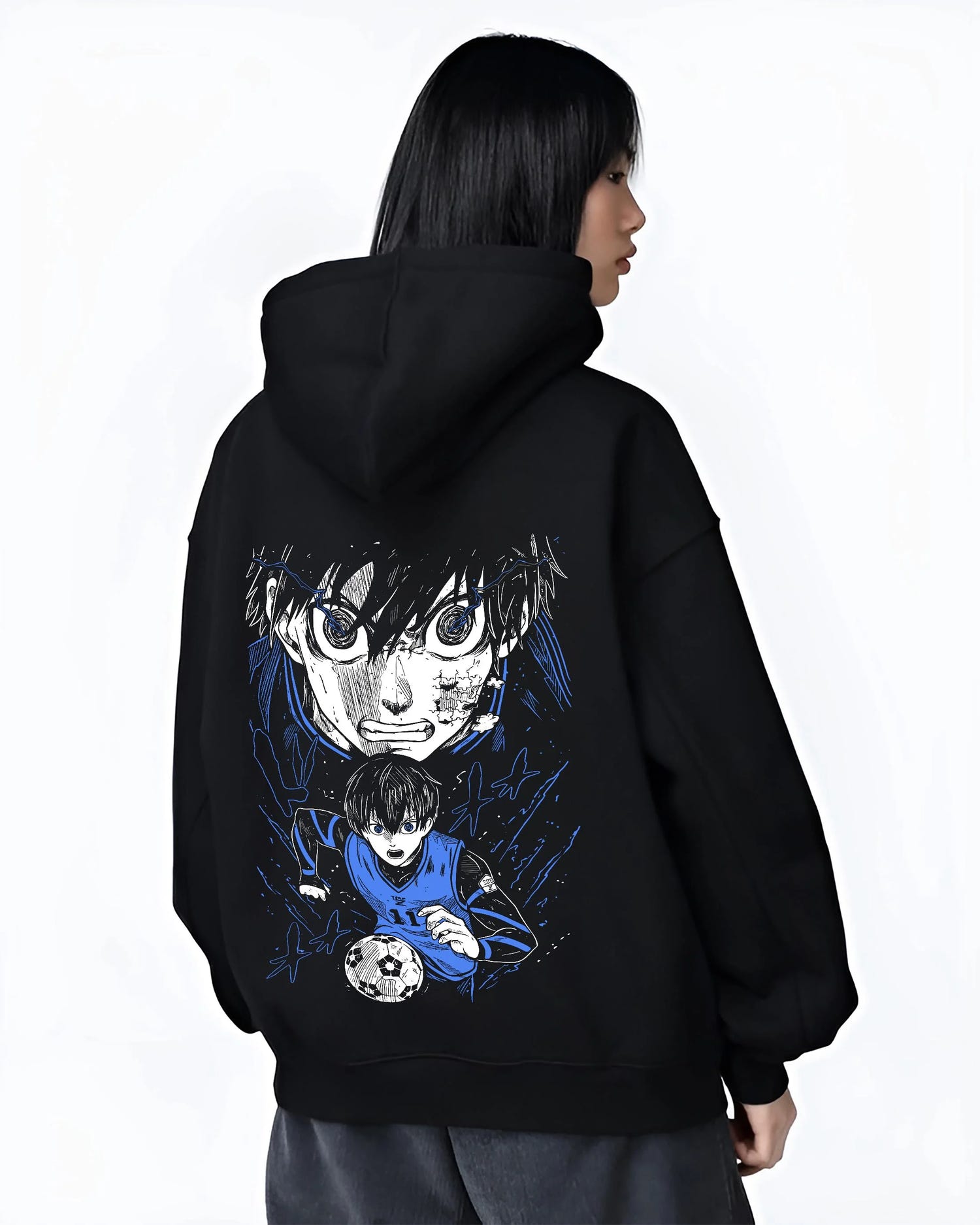 Black hoodie worn by female model, back view with Blue Lock Hoodie Isagi Yoichi Intense Stare Jumper graphic bold anime graphic.