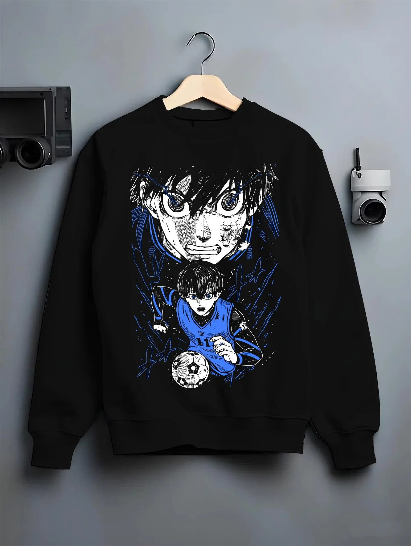 Black crewneck sweatshirt on hanger with Blue Lock Hoodie Isagi Yoichi Intense Stare Jumper graphic premium wear.