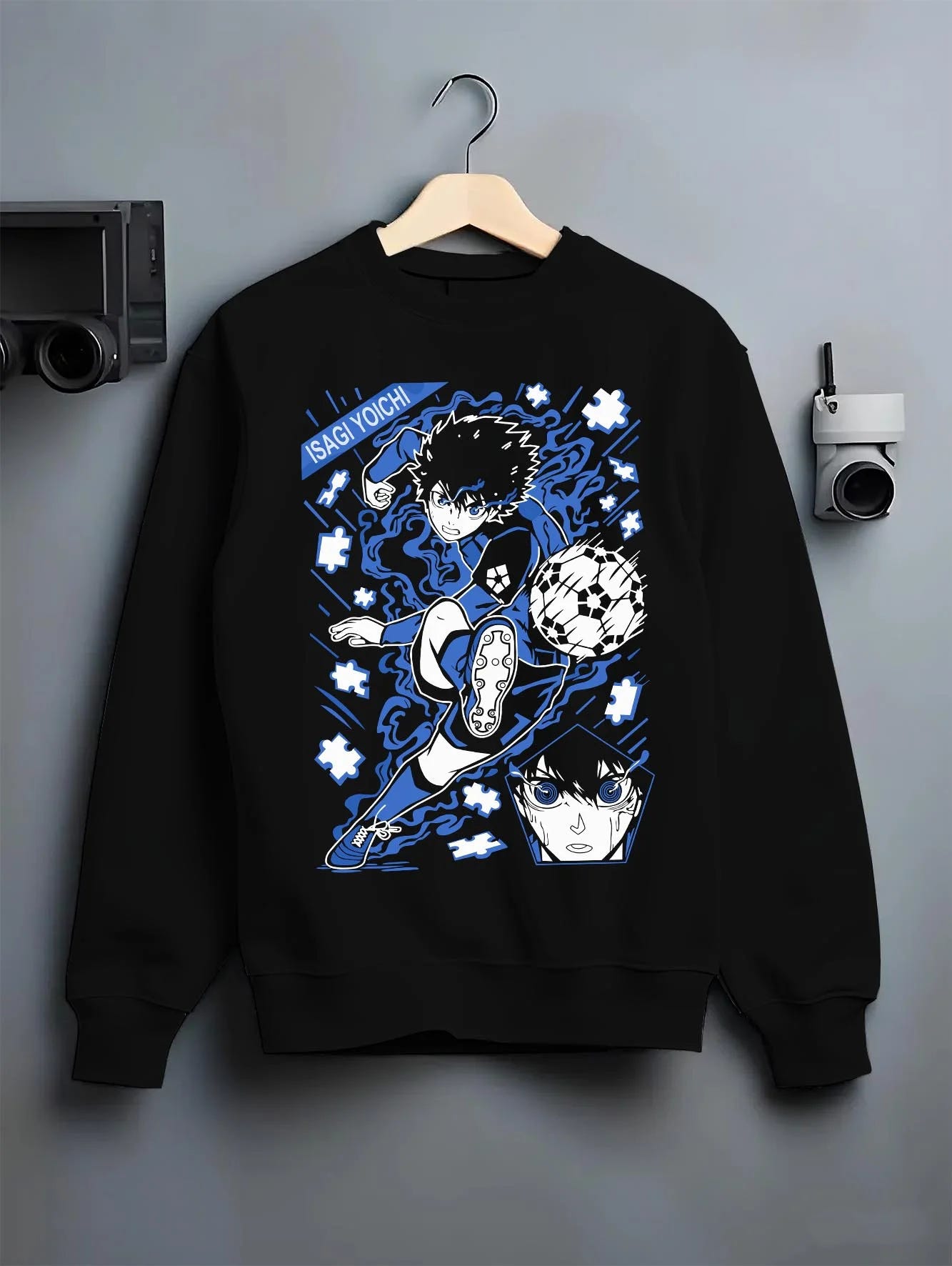 Black crewneck sweatshirt on hanger with Blue Lock Hoodie Isagi Yoichi Goal Kick Jumper graphic streetwear graphic.