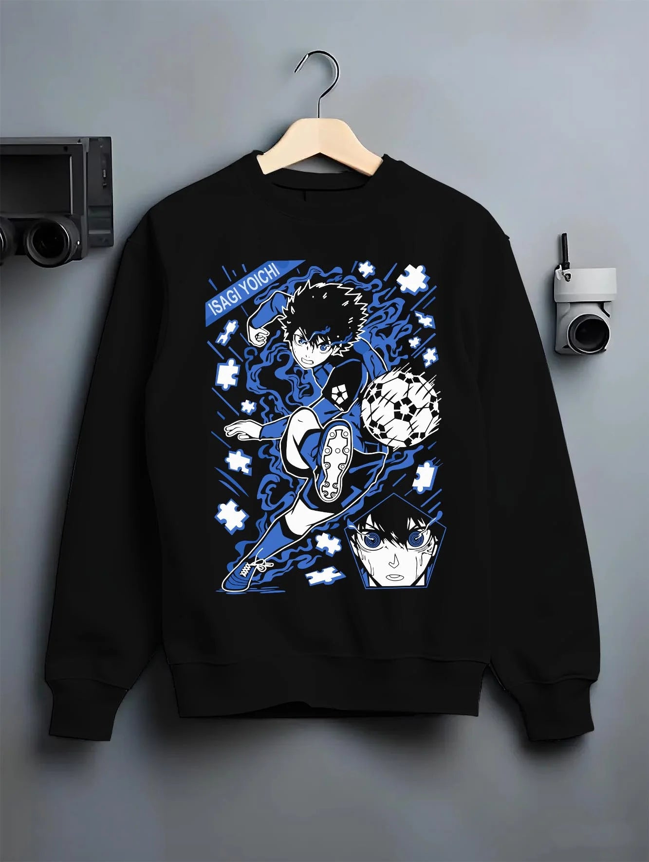 Black crewneck sweatshirt on hanger with Blue Lock Hoodie Isagi Yoichi Goal Kick Jumper graphic streetwear graphic.