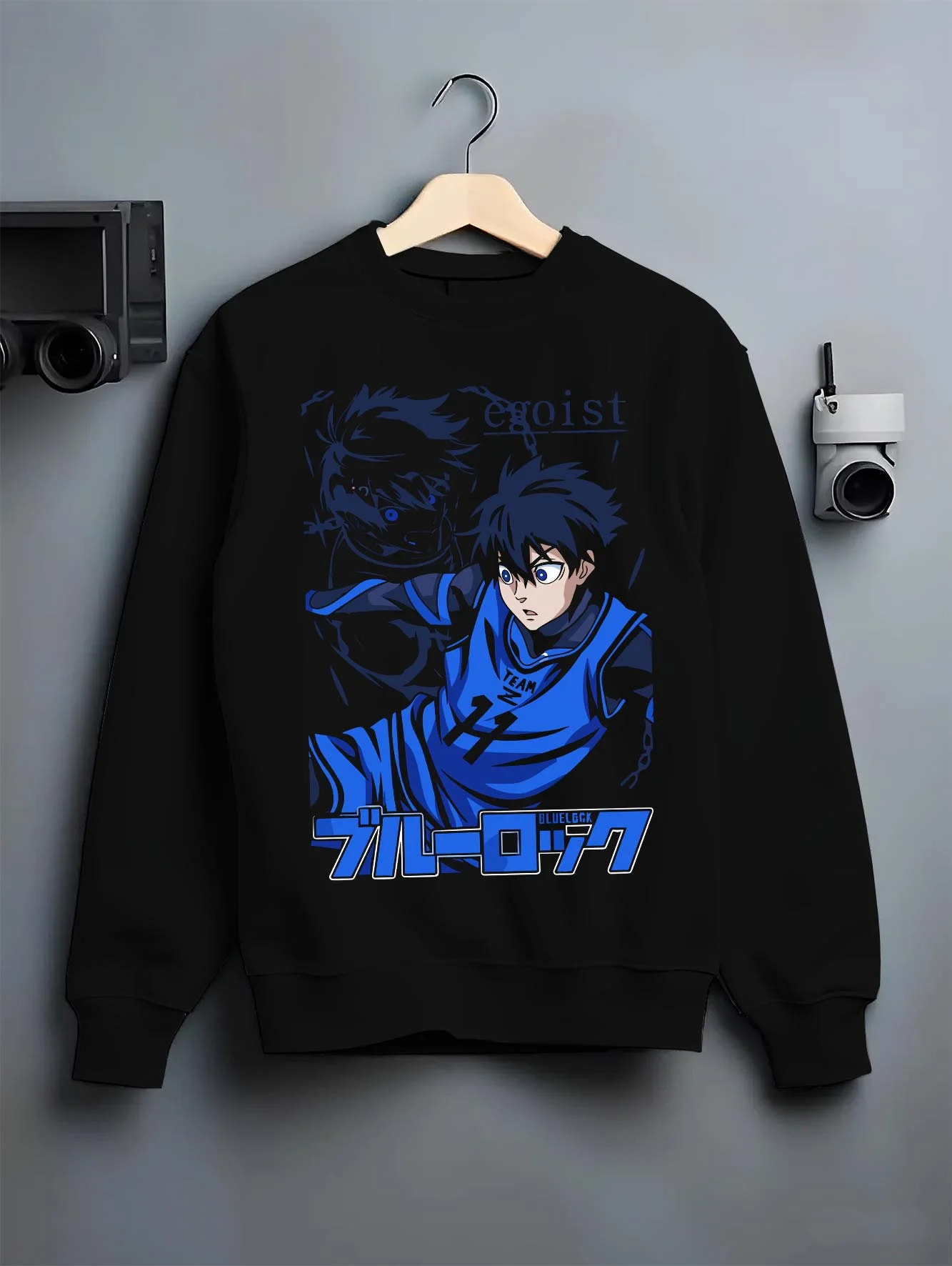 Black crewneck sweatshirt on hanger with Blue Lock Hoodie Isagi Yoichi Power Shot Jumper graphic bold anime graphic.