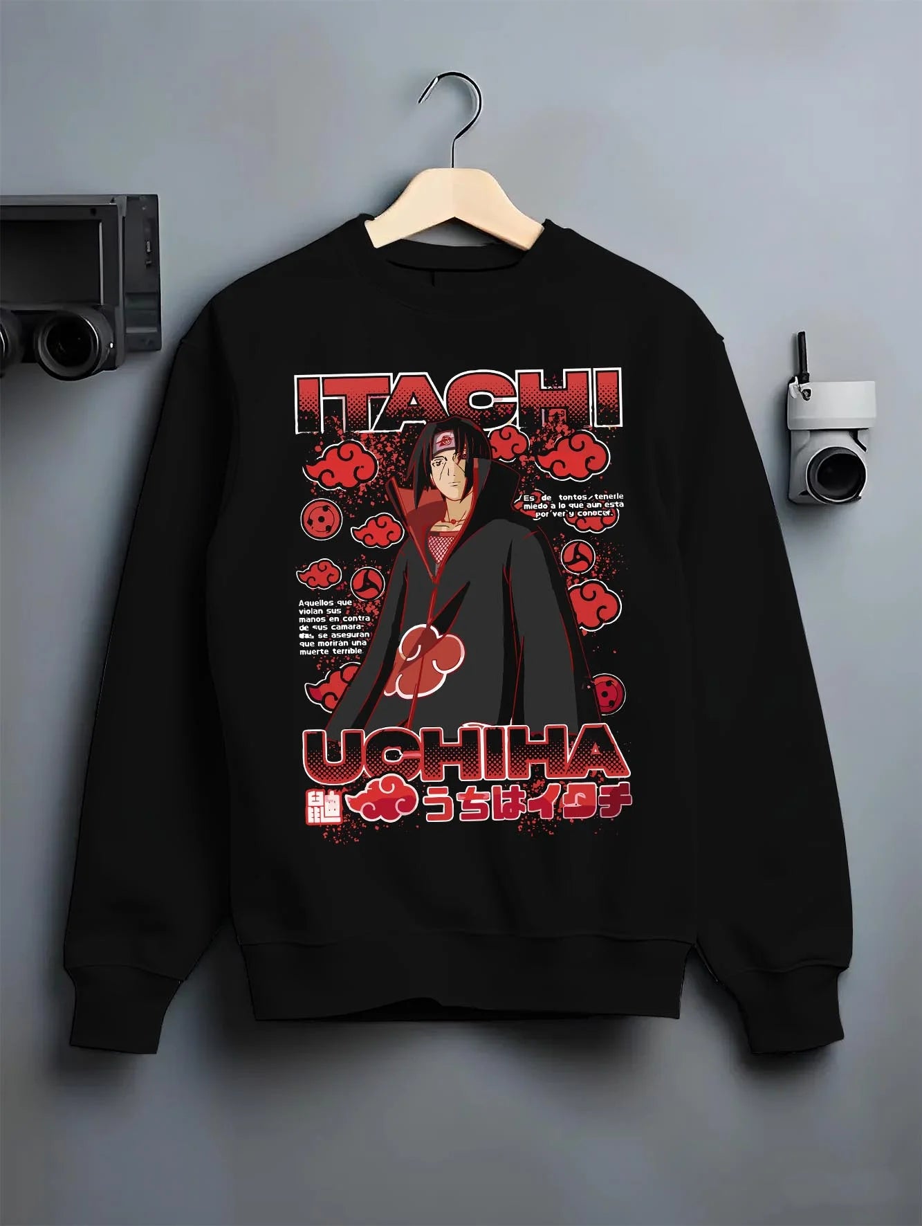 Black crewneck sweatshirt on hanger with Naruto Hoodie Itachi Uchiha Akatsuki Clan Jumper graphic bold anime graphic.