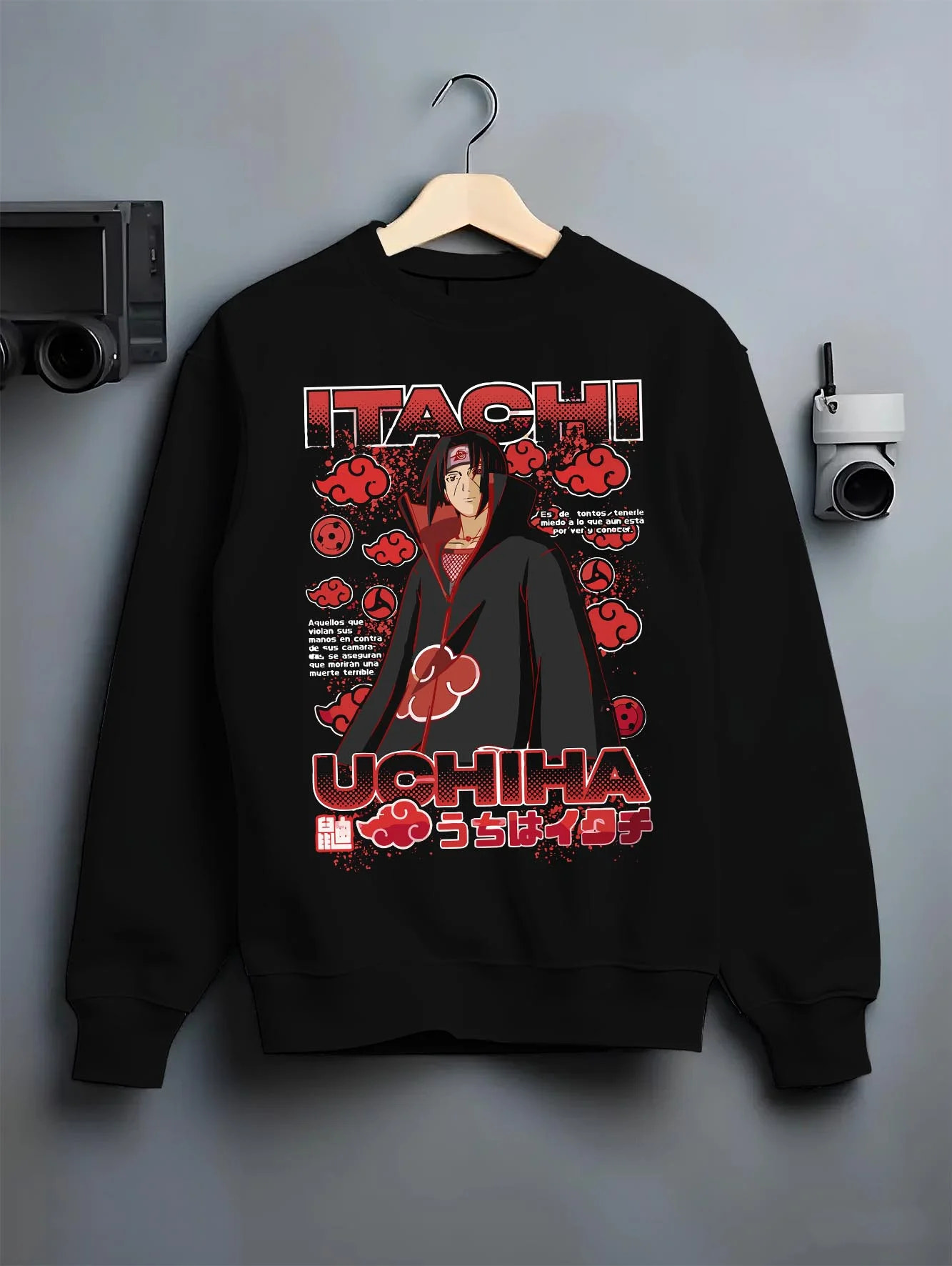 Black crewneck sweatshirt on hanger with Naruto Hoodie Itachi Uchiha Akatsuki Clan Jumper graphic bold anime graphic.