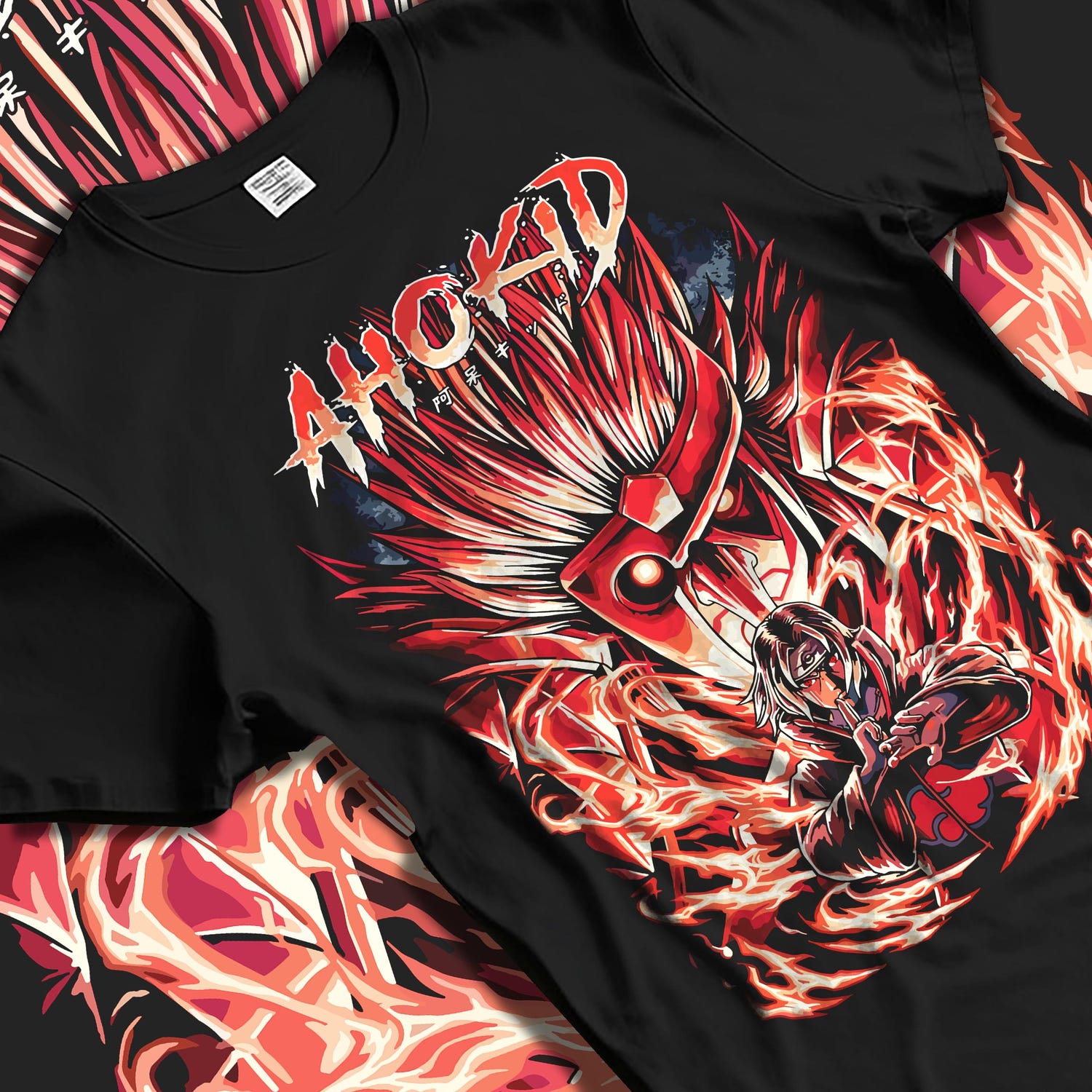 Black T-shirt laid flat with natural fabric folds, featuring Itachi Uchiha anime poster inspired design with fiery Susanoo aura detailing.