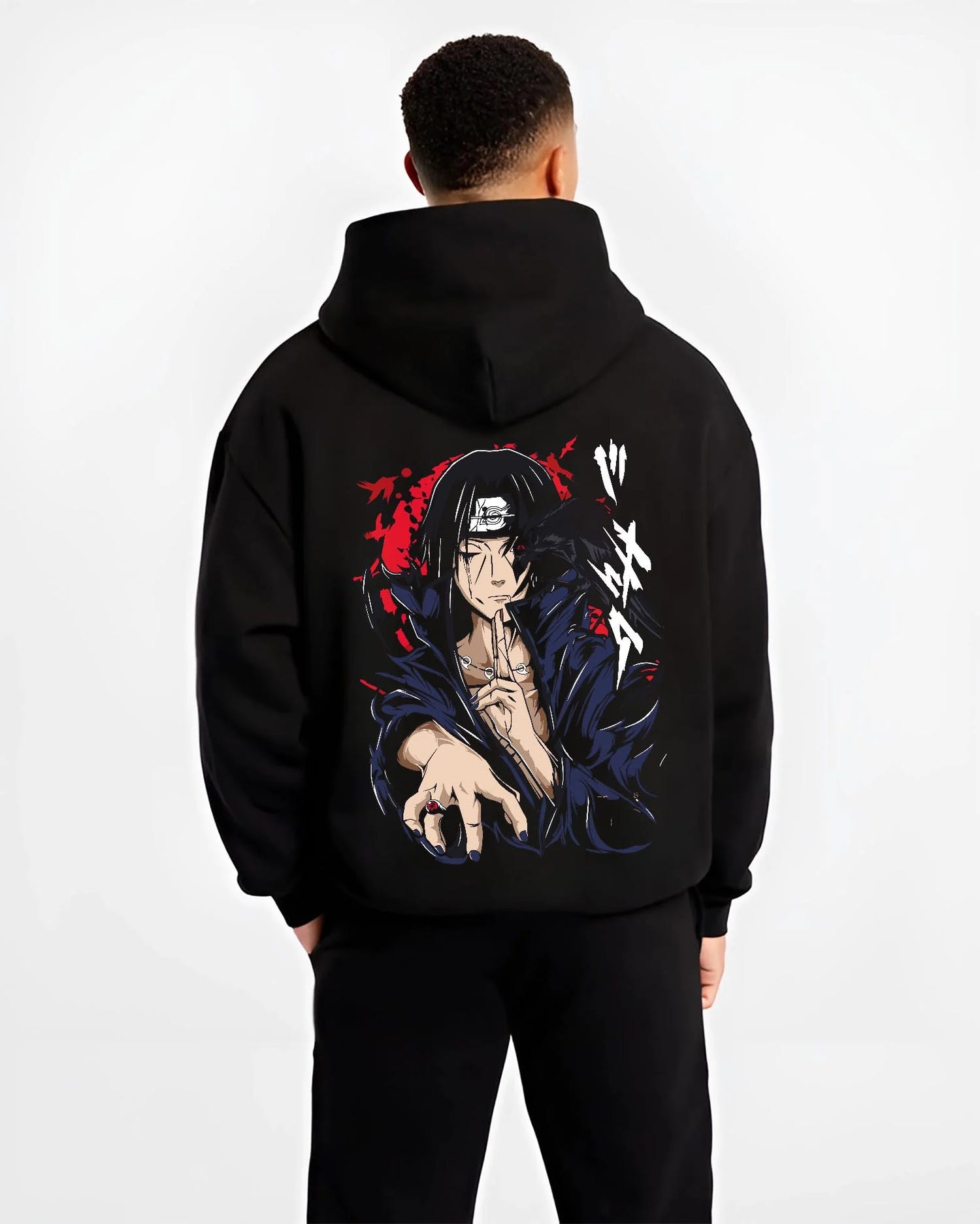 Black hoodie worn by male model, back view with Naruto Hoodie Itachi Uchiha Crow Summon Clan Jumper graphic premium wear.