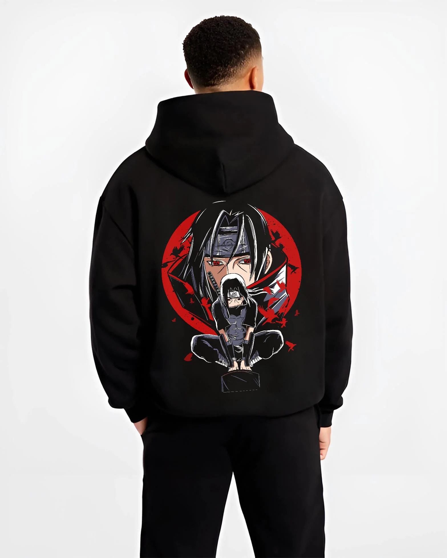 Black hoodie worn by male model, back view with Naruto Hoodie Itachi Uchiha Mangekyo Clan Jumper graphic bold anime graphic.