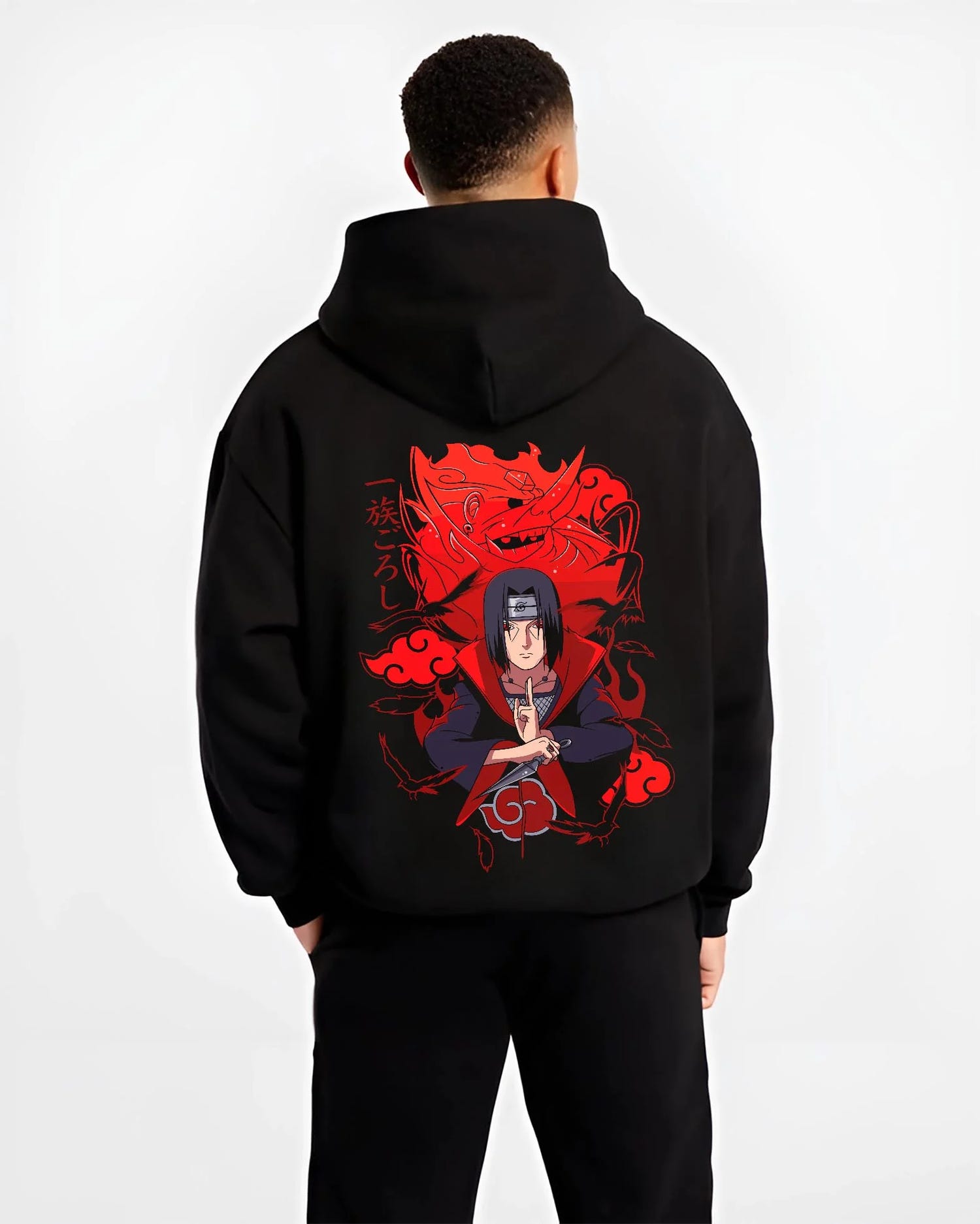 Black hoodie worn by male model, back view with Naruto Hoodie Itachi Uchiha Anbu Red Flame Jumper graphic bold anime graphic.