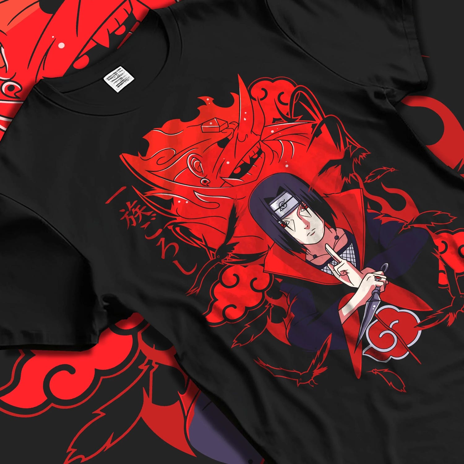 Black T-shirt laid flat with natural folds with Naruto Hoodie Itachi Uchiha Anbu Red Flame Jumper graphic bold anime graphic.