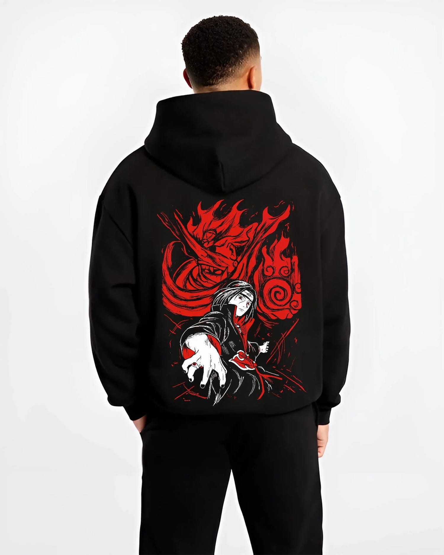 Black hoodie worn by male model, back view with Naruto Hoodie Itachi Uchiha Sharingan Power Jumper graphic streetwear graphic.