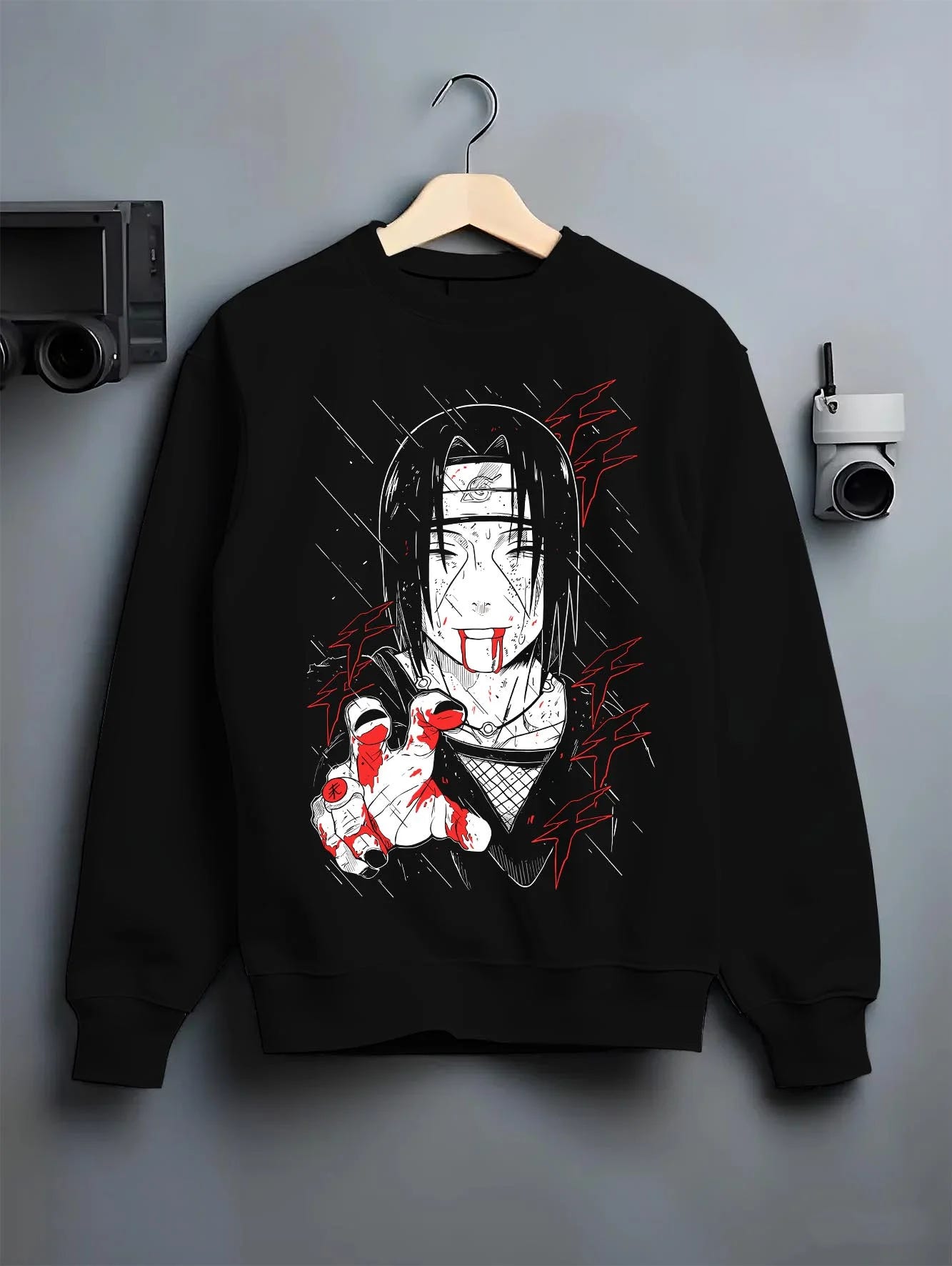 Black crewneck sweatshirt on hanger with Naruto Hoodie Itachi Uchiha Cursed Agent Jumper graphic streetwear graphic.