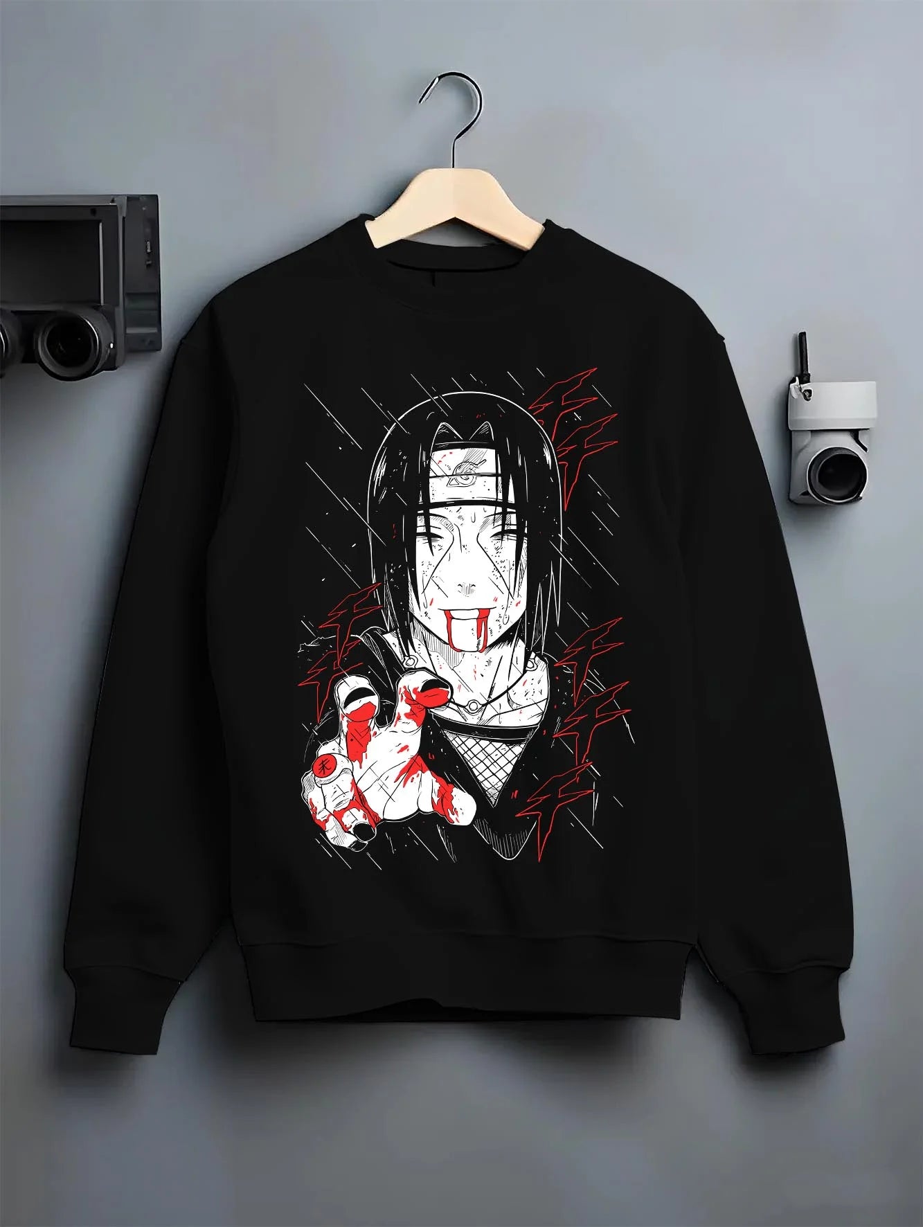 Black crewneck sweatshirt on hanger with Naruto Hoodie Itachi Uchiha Cursed Agent Jumper graphic streetwear graphic.