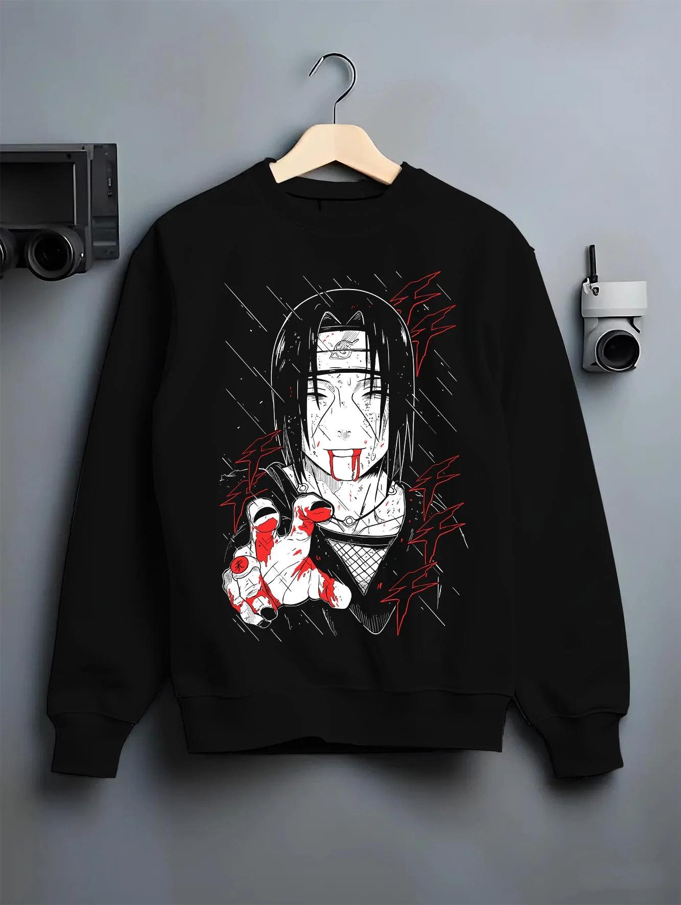 Black crewneck sweatshirt on hanger with Naruto Hoodie Itachi Uchiha Cursed Agent Jumper graphic streetwear graphic.