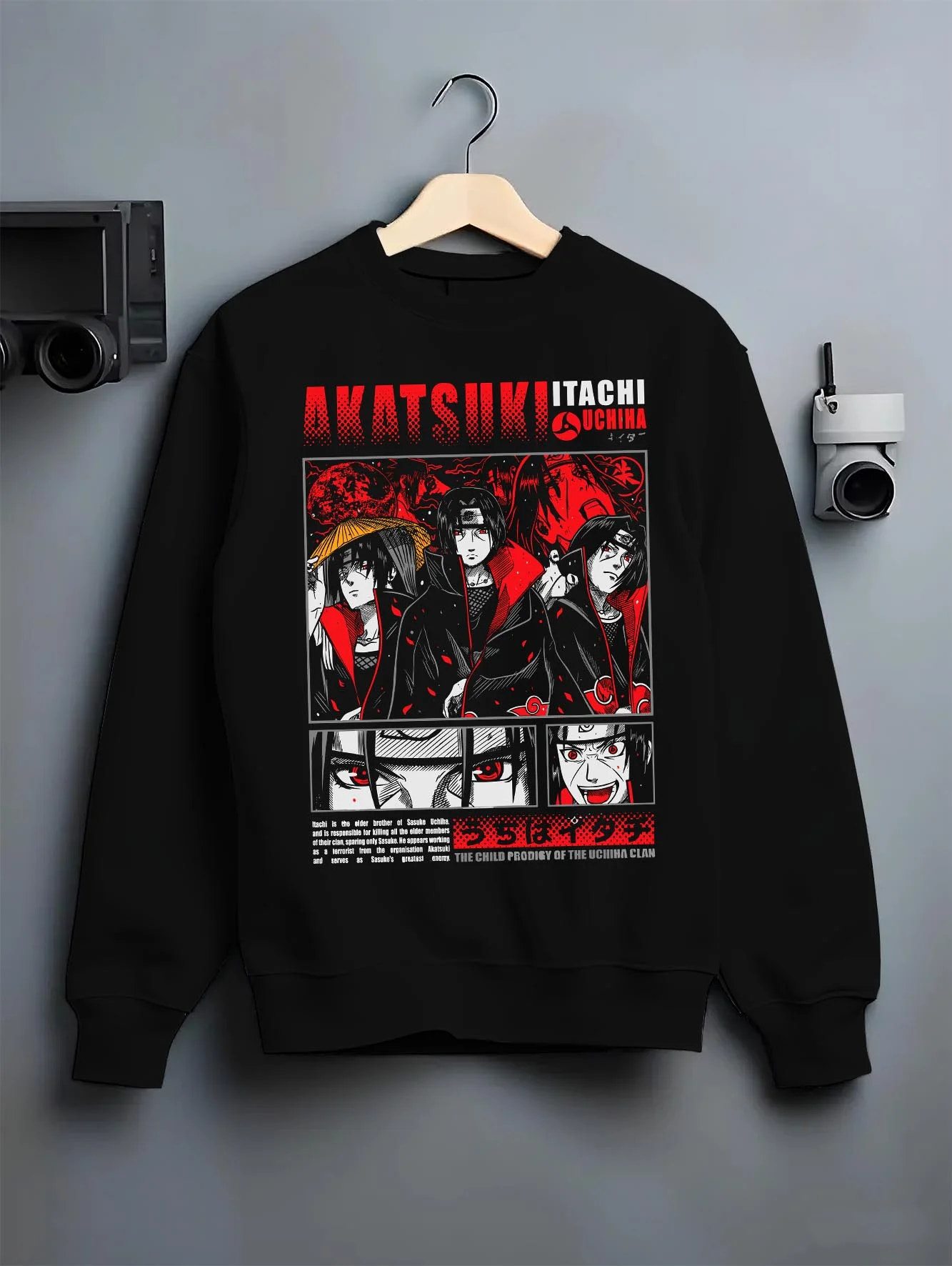 Black crewneck sweatshirt on hanger with Naruto Hoodie Itachi and Sasuke Uchiha Clan Jumper graphic streetwear graphic.