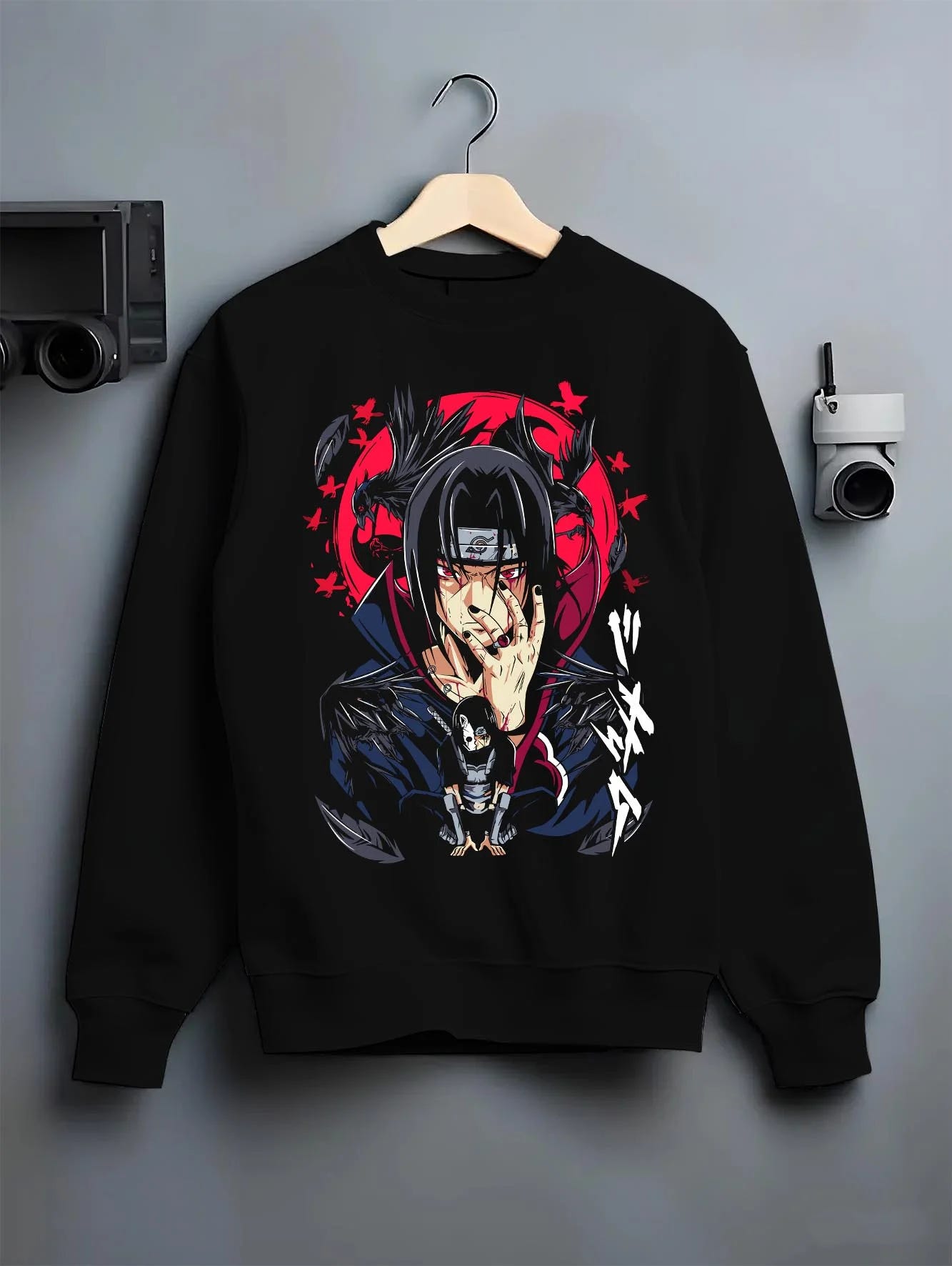 Black crewneck sweatshirt on hanger with Naruto Hoodie Itachi Uchiha Susanoo Spirit Jumper graphic streetwear graphic.
