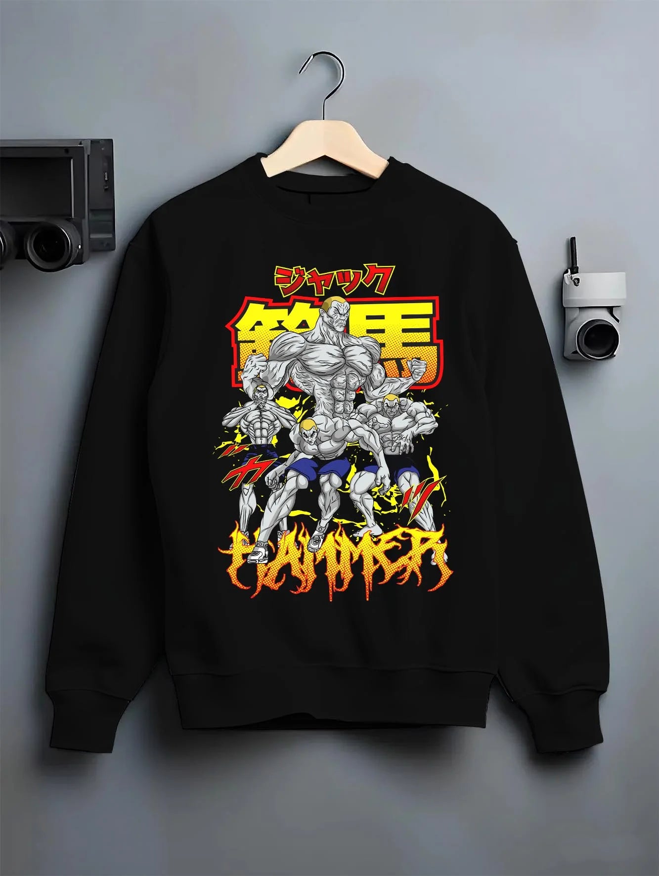 Black crewneck sweatshirt on hanger with Baki Hoodie Hanma Baki Fierce Fighting Spirit Jumper graphic Baki anime graphic.