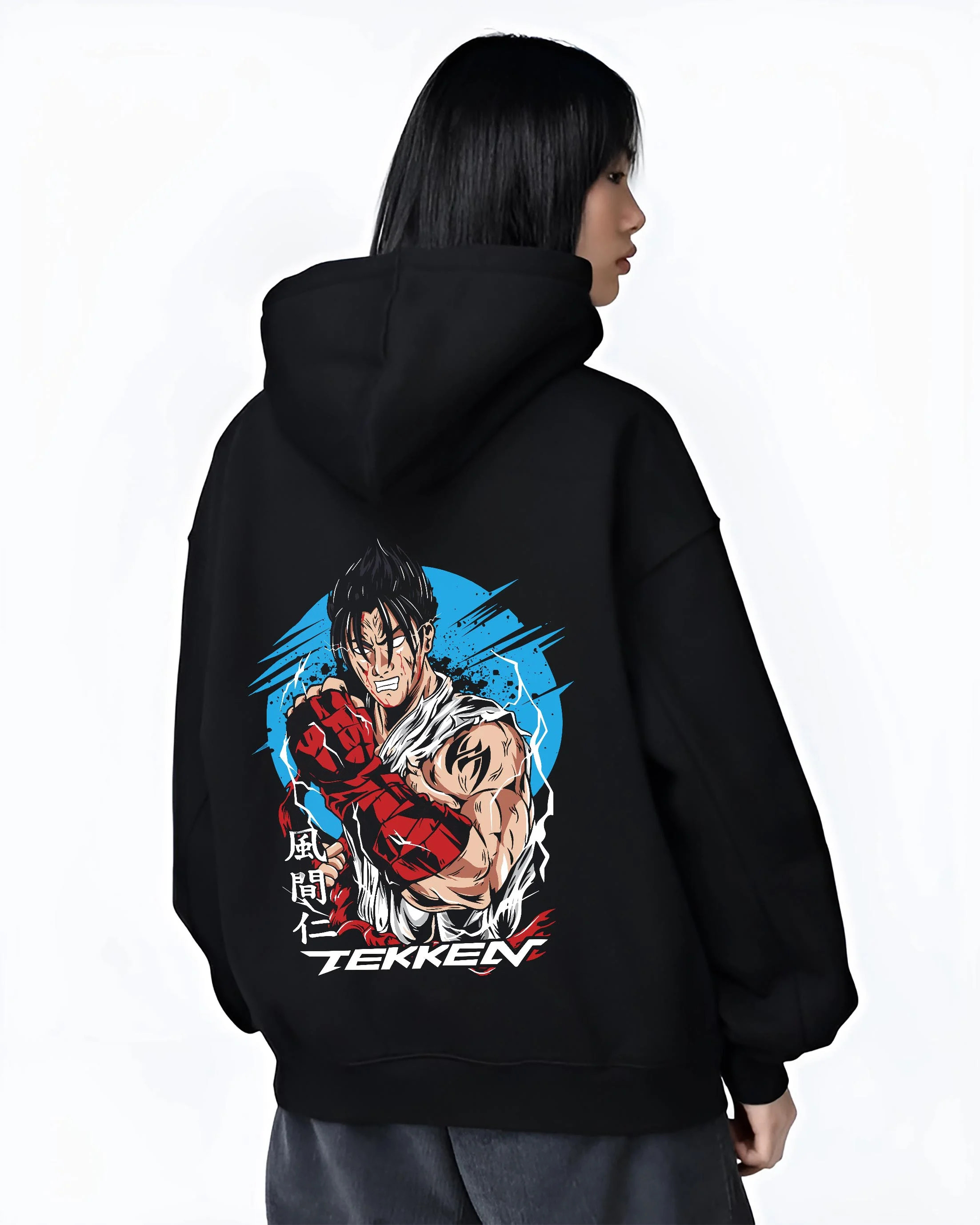 Black hoodie worn by female model, back view with Tekken Hoodie Jin Kazama Iron Fist Champion Jumper graphic bold anime graphic.