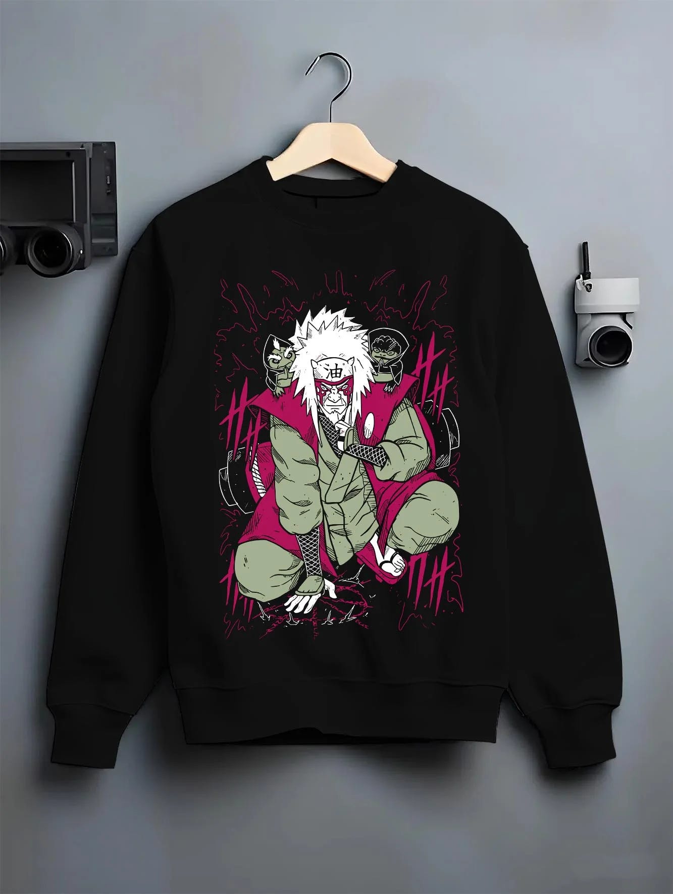 Black crewneck sweatshirt on hanger with Naruto Hoodie Jiraiya Legendary Sannin Ninja Jumper graphic streetwear graphic.