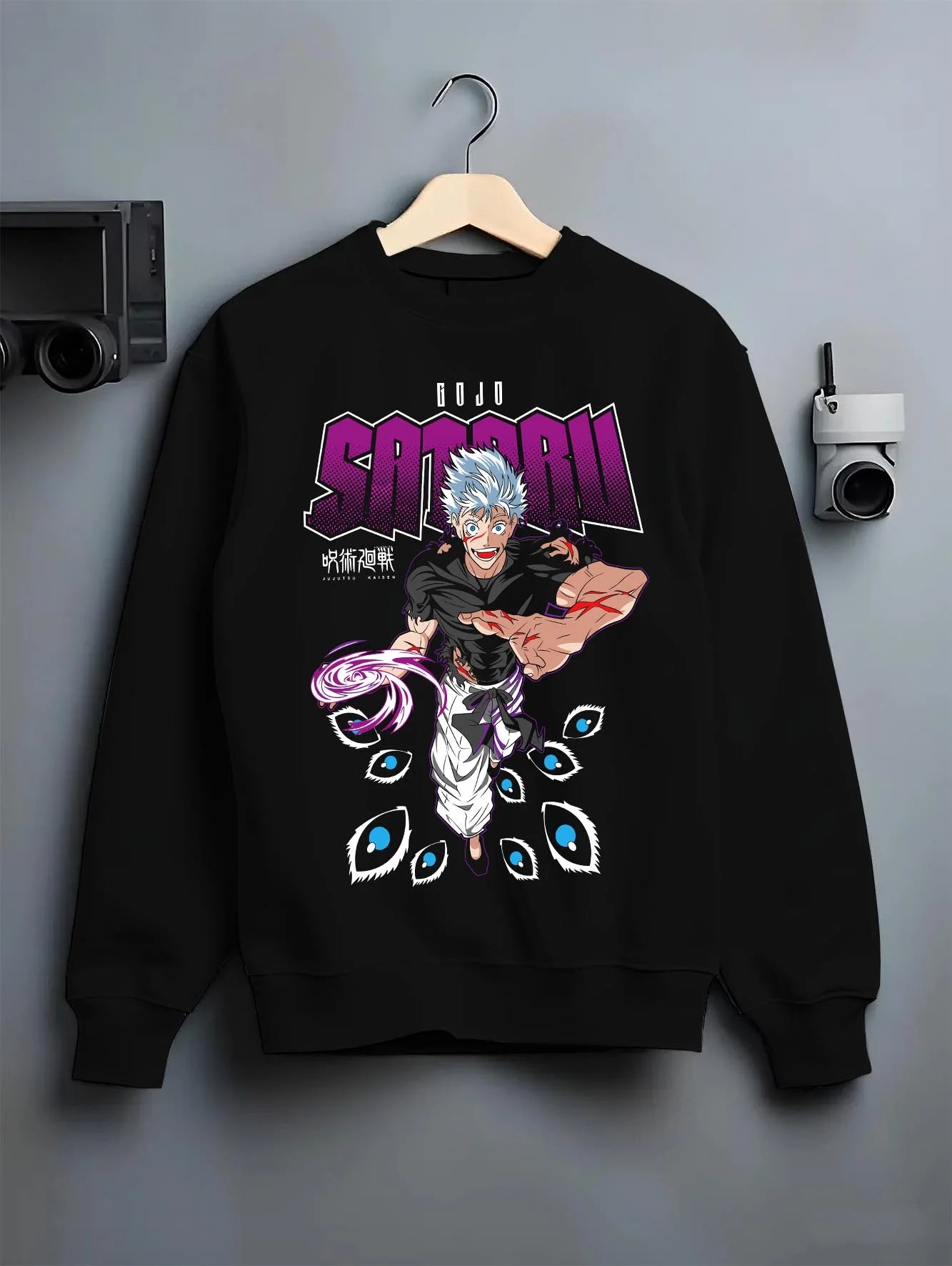 Black crewneck sweatshirt on hanger with Jujutsu Kaisen Hoodie Satoru Gojo Mystic Power Jumper graphic premium wear.