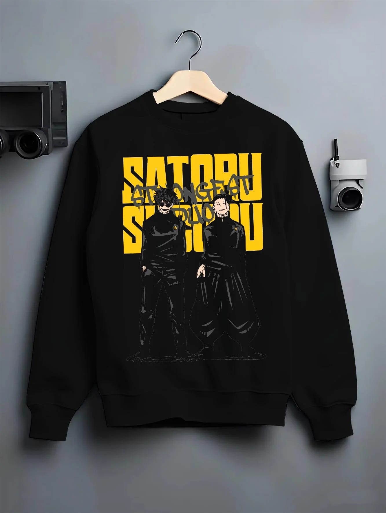 Black crewneck sweatshirt on hanger with Jujutsu Kaisen Hoodie Satoru Gojo Twin Pose Jumper graphic bold anime graphic.