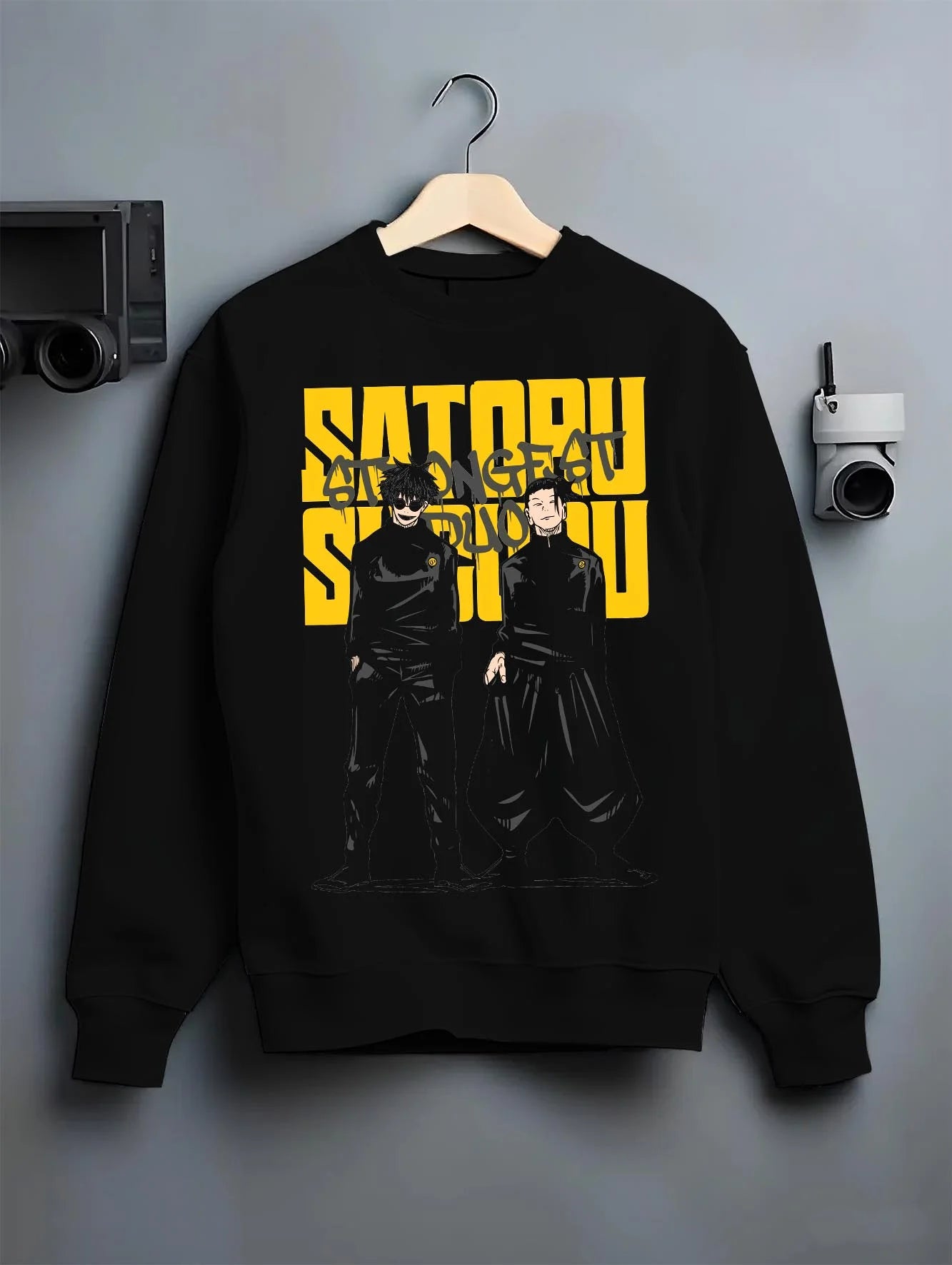 Black crewneck sweatshirt on hanger with Jujutsu Kaisen Hoodie Satoru Gojo Twin Pose Jumper graphic bold anime graphic.