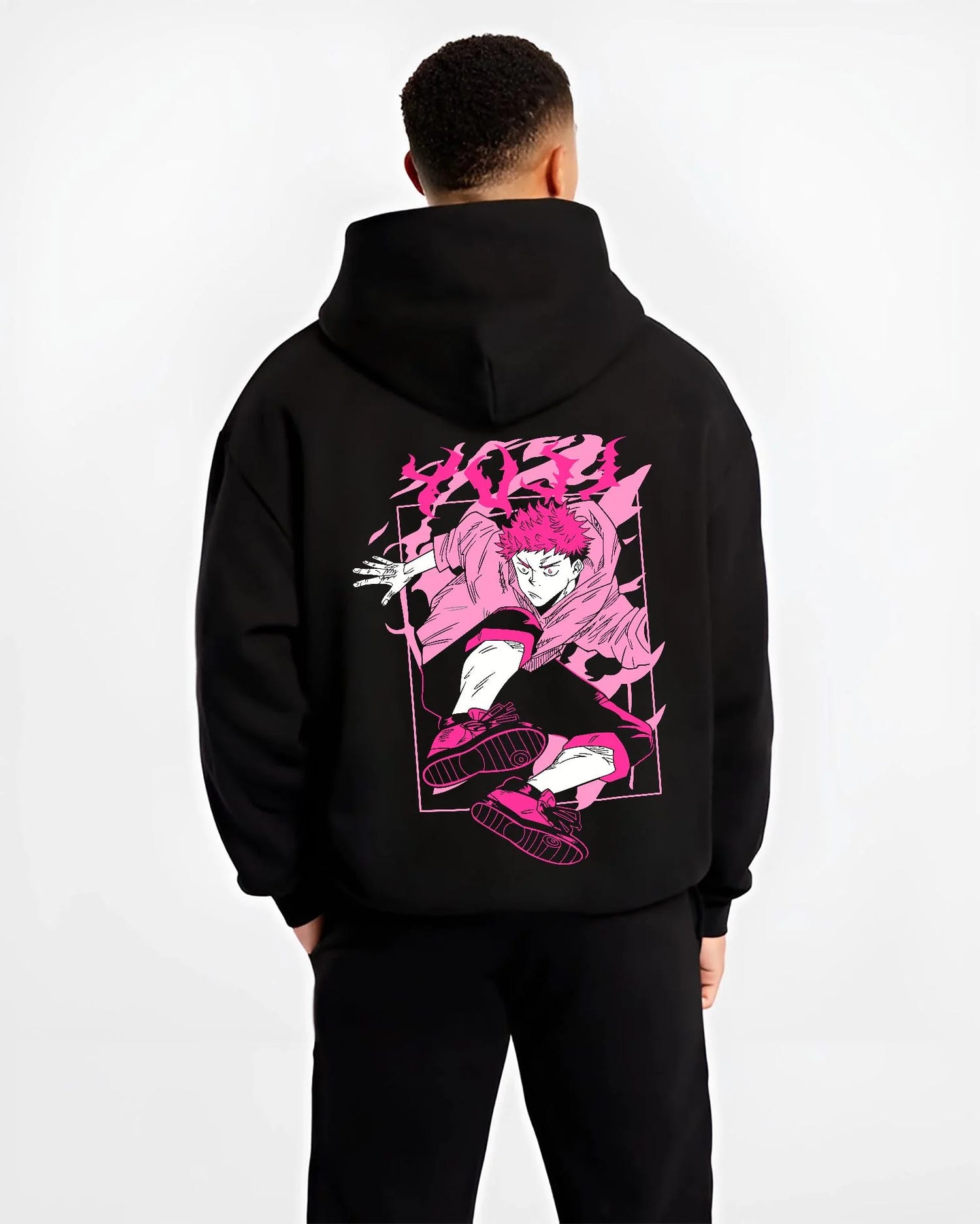 Black hoodie worn by male model, back view with Jujutsu Kaisen Hoodie Yuji Itadori Dynamic Jump Jumper graphic streetwear graphic.