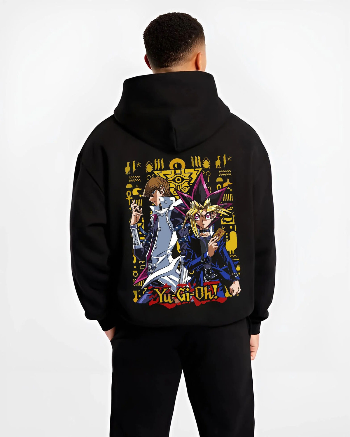 Black hoodie worn by male model from the back featuring Yugi and Kaiba duel rivals artwork.