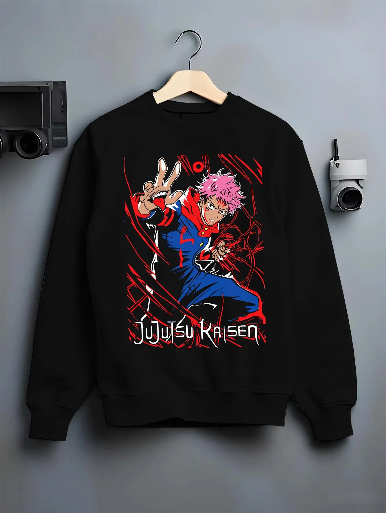 Black crewneck sweatshirt on hanger with Jujutsu Kaisen Hoodie Yuji Itadori Hero Punch Jumper graphic streetwear graphic.