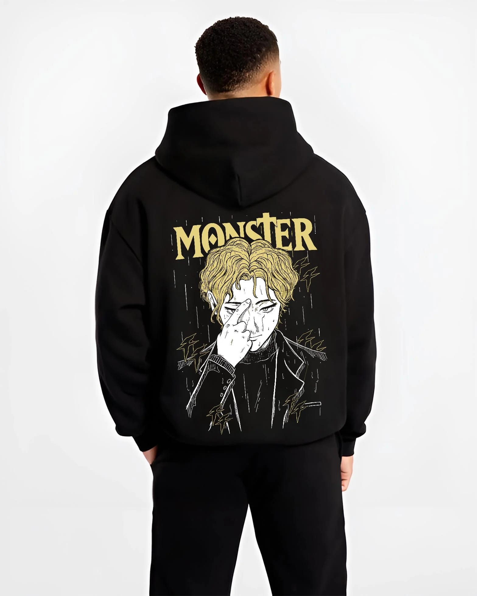 Black hoodie worn by male model, back view with Monster Hoodie Johan Liebert Psychological Thriller graphic bold anime graphic.
