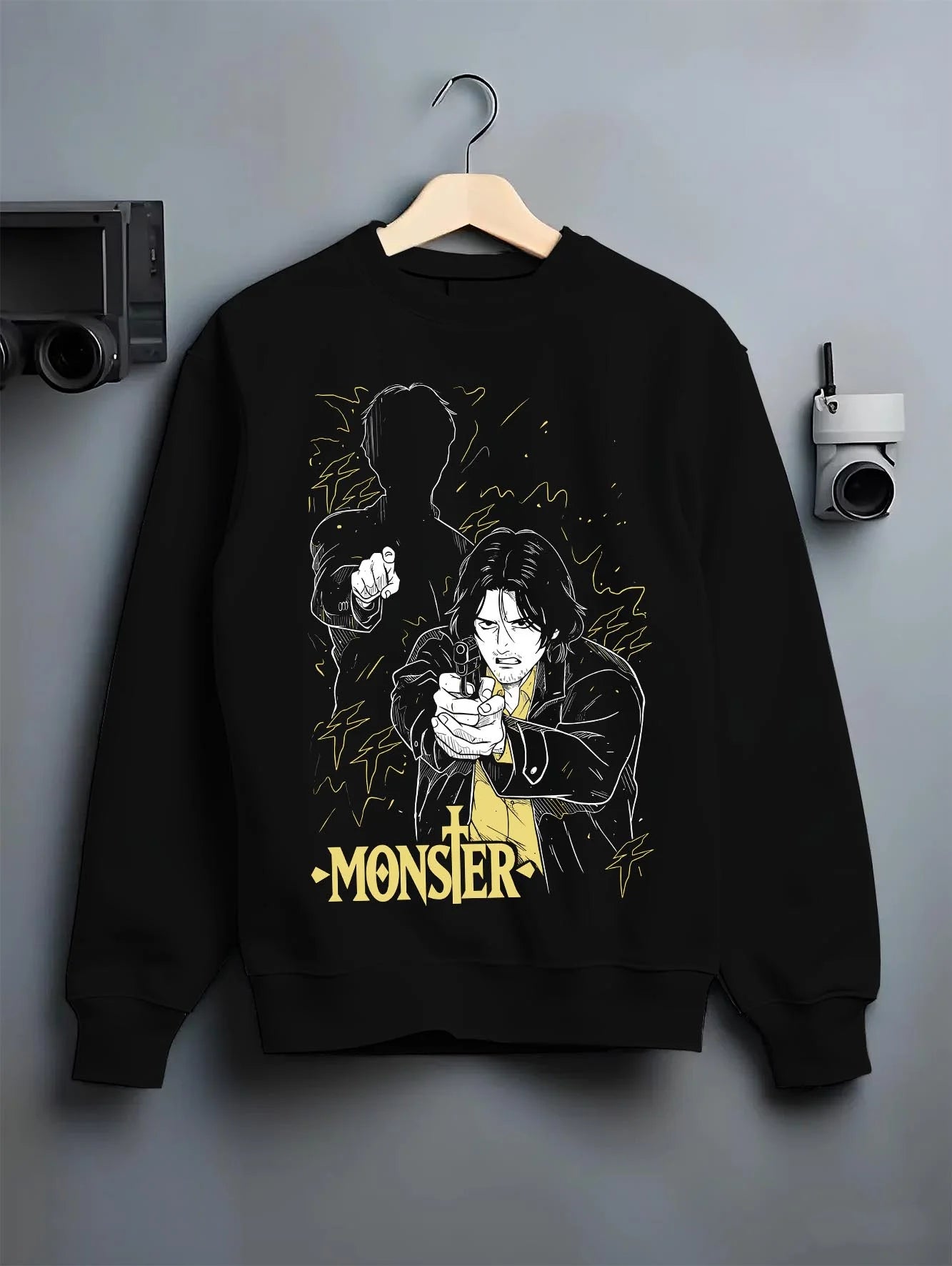 Black crewneck sweatshirt on hanger with Monster Hoodie Johan Dark Mystery Thriller Jumper graphic premium wear.