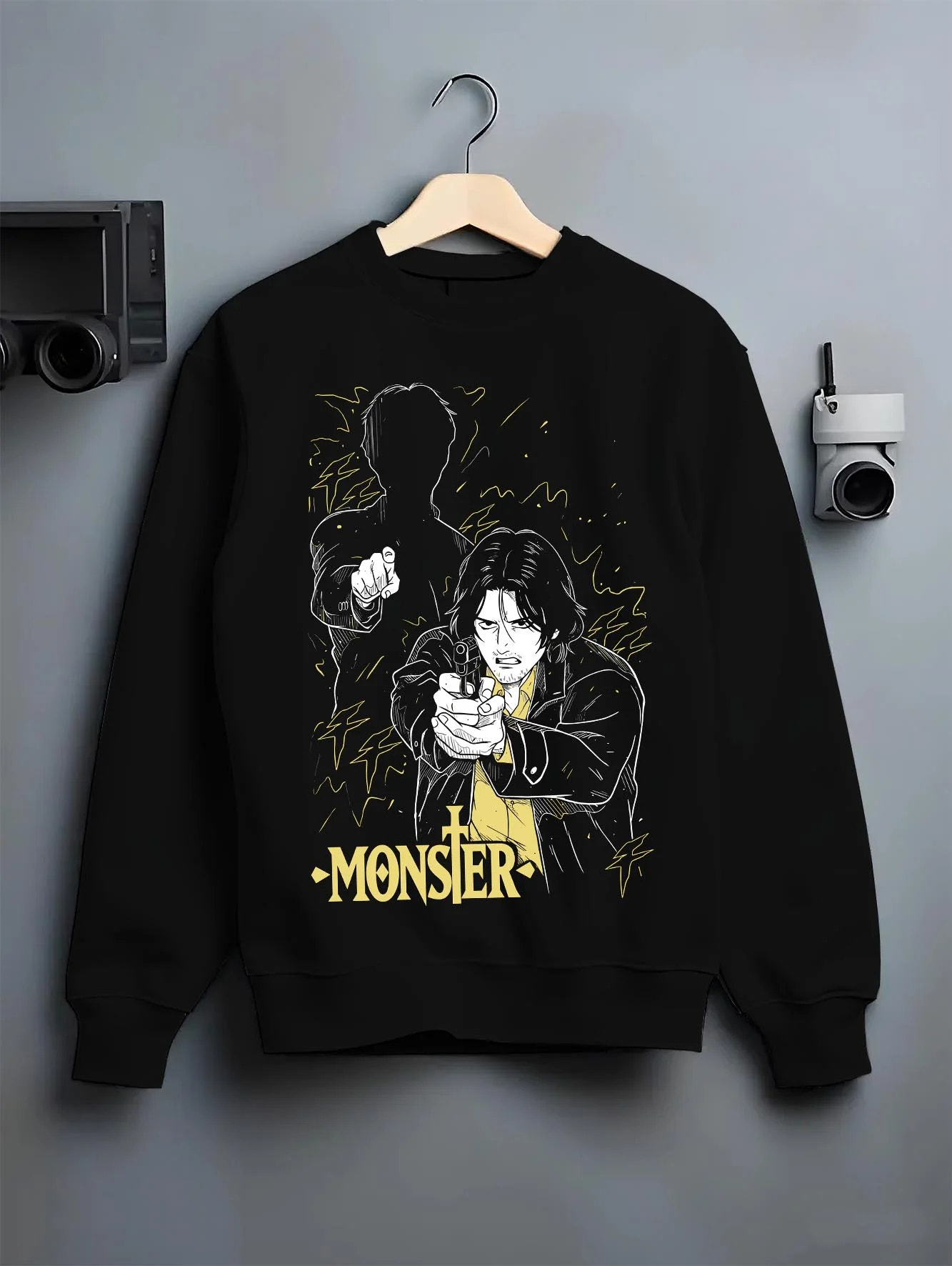 Black crewneck sweatshirt on hanger with Monster Hoodie Johan Dark Mystery Thriller Jumper graphic premium wear.