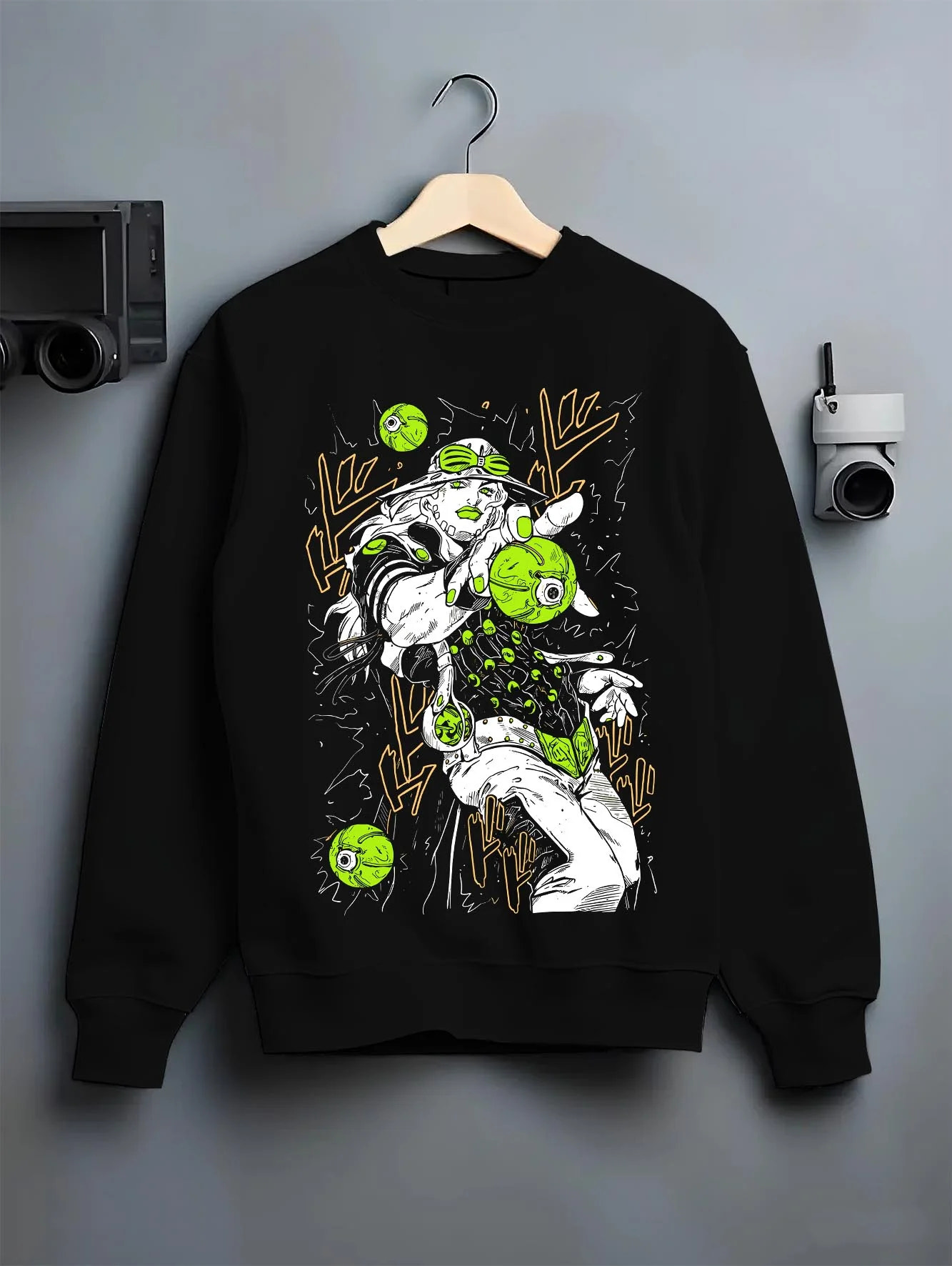 Black crewneck sweatshirt on hanger with Jolyne Cujoh Hoodie JoJo’s Bizarre Adventure Stone Ocean graphic premium wear.