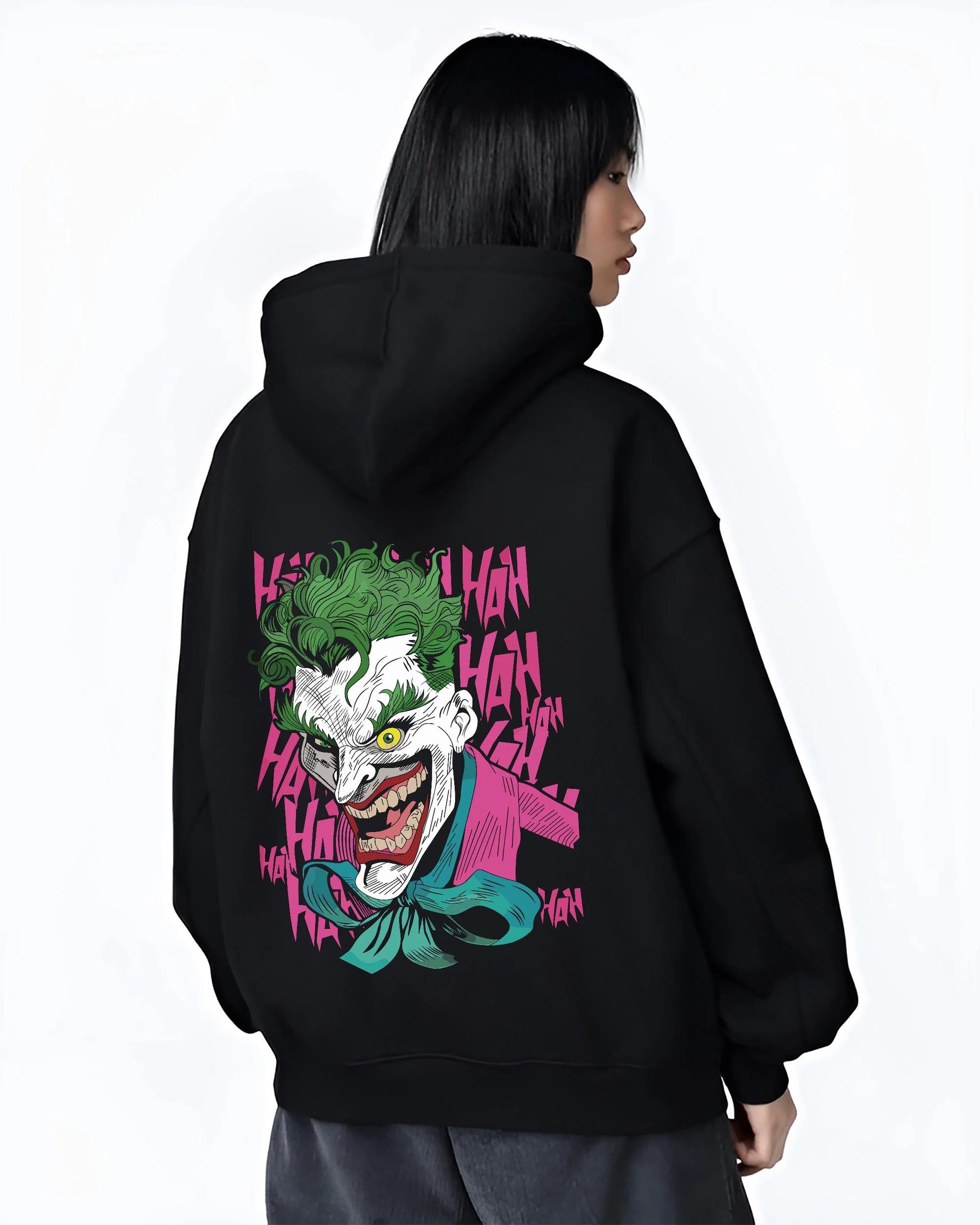Black hoodie worn by female model, back view with Joker Hoodie Gotham Anime Inspired Laughing Villain Design graphic Joker anime design.